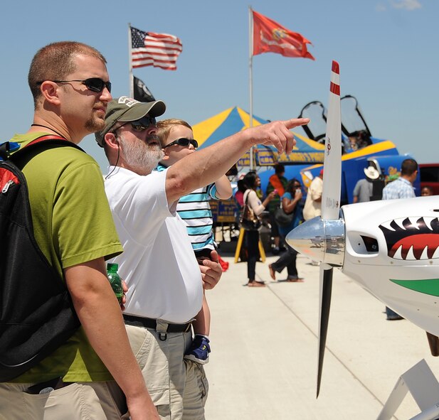 Spectators watch as a B-52H Stratofortress flies over the base flightline during the 2012 Barksdale Air Force Base Defenders of Liberty Air Show April 22. This year's show was especially significant for the base, as 2012 marks the 60th anniversary of the first flight of the B-52H, and 50 years since the last B-52H Stratofortress was delivered from the assembly line to the Air Force. (U.S. Air Force photo/Staff Sgt. Amber Ashcraft) (RELEASED)