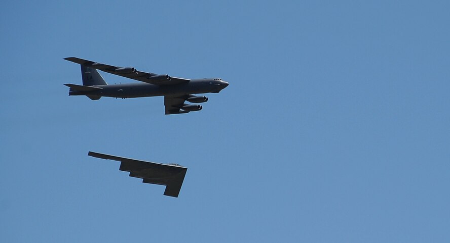 A B-52H Stratofortress and a B-2 Spirit fly together over a crowd of spectators at the 2012 Barksdale Air Force Base Defenders of Liberty Air Show April 21. The annual base air show provides the 2nd Bomb Wing an opportunity to showcase the Air Force mission and to say thanks to the Shreveport-Bossier community for generously supporting Barksdale Air Force Base. (U.S. Air Force photo/Staff Sgt. Amber Ashcraft) (RELEASED)