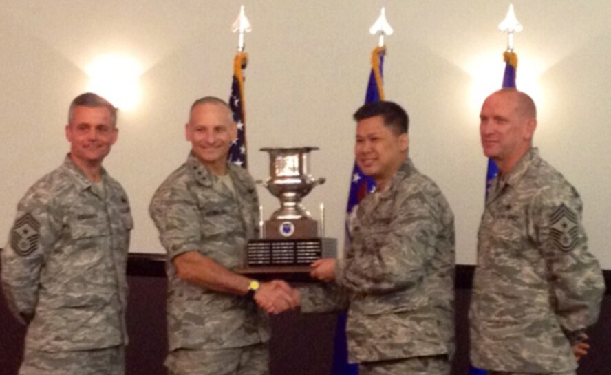 Air Force Global Strike Command Commander Lt. Gen. Jim Kowalski and AFGSC Command Chief Chief Master Sgt. Brian Hornback, presented three trophies to Col. H.B. Brual, 341st Missile Wing Commander and Chief Master Sgt. Chuck Anderson, 341st MW Command Chief, during the AFGSC Commander's Conference at Barksdale Air Force Base, La., earlier this month. The trophies include, from top to bottom, the Col. Lee R. Williams Memorial Award, the Gen. Samuel C. Phillip Award and the Col. Lowell F. McAdoo Award. (U.S. Air Force/courtesy photo)