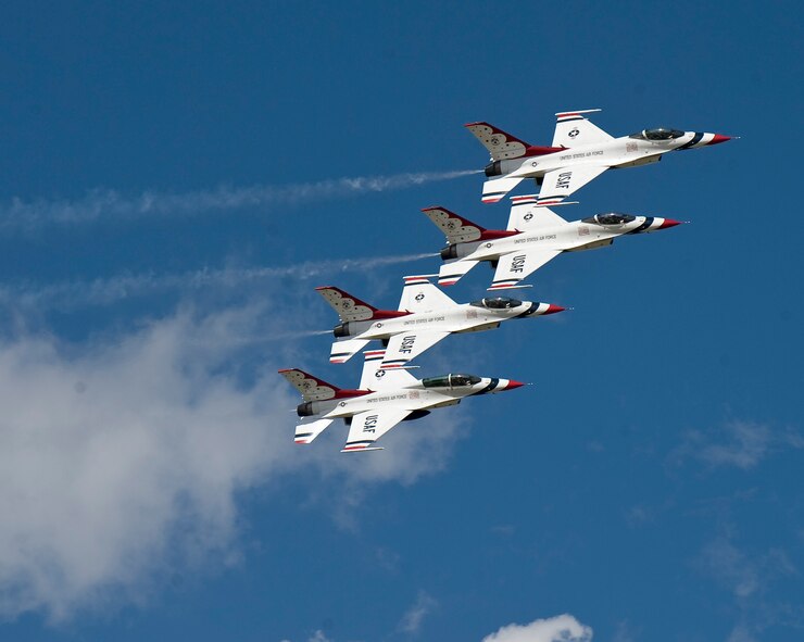 Four members of the U.S. Air Force Thunderbirds perform an Echelon Pass during the 2012 Barksdale Air Force Base Defenders of Liberty Air Show April 22. The Air Force Air Demonstration Squadron Thunderbirds, based at Nellis Air Force Base, Nev., is the Air Force's premier aerial demonstration team, performing at air shows and special events worldwide. (U.S. Air Force photo/Staff Sgt. Chad Warren)(RELEASED)