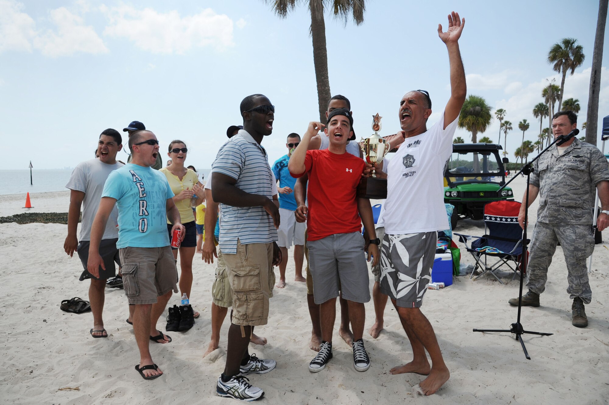 MACDILL AIR FORCE BASE, Fla. -- To the victors go the spoils.  Members of the 927th Air Refueling Wing celebrate after winning multiple events demanding teamwork, speed, and endurance.  Many units participated in the activities during the 927th Air Refueling Wing's Family Day, an event that brought reservists' families together to thank them for their support. (Official U.S. Air Force photo by Staff Sgt. Jennie Chamberlin)