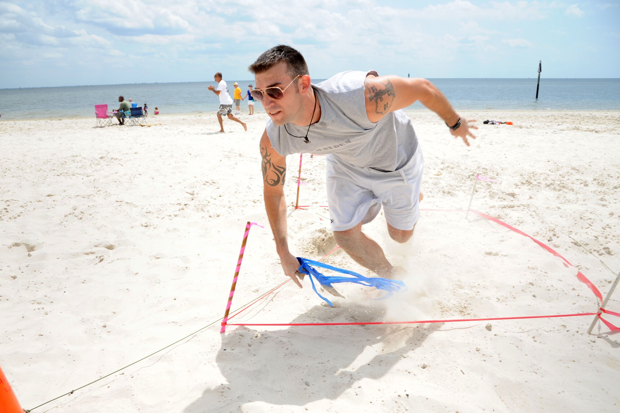 MACDILL AIR FORCE BASE, Fla. -- Staff Sgt. Michael Hayden, an intelligence analyst with the 927th Operations Group, turns the corner to bring in the win for his team.  Hayden was running an obstacle course during the 927th Air Refueling Wing's Family Day, an event designed to bring together and thank the families of the reservists who make up the unit.  (Official U.S. Air Force photo by Staff Sgt. Jennie Chamberlin)