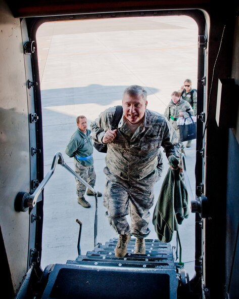 Col. Darrell G. Young, 934th Airlift Wing commander, boards a C-17 for the flight to Gulfport, Miss.  (US Air Force Photo/Tech Sgt. Jim Loehr)