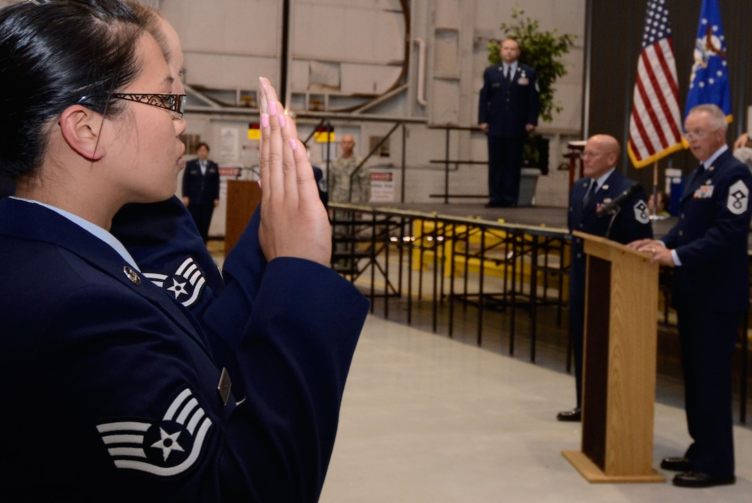 Chief Master Sgt. Wendell L. Peacock, 94th Airlift Wing command chief administers the NCO Charge to those Noncommissioned Officers newly inducted at a ceremony April 14. (U.S. Air Force photo/Don Peek)