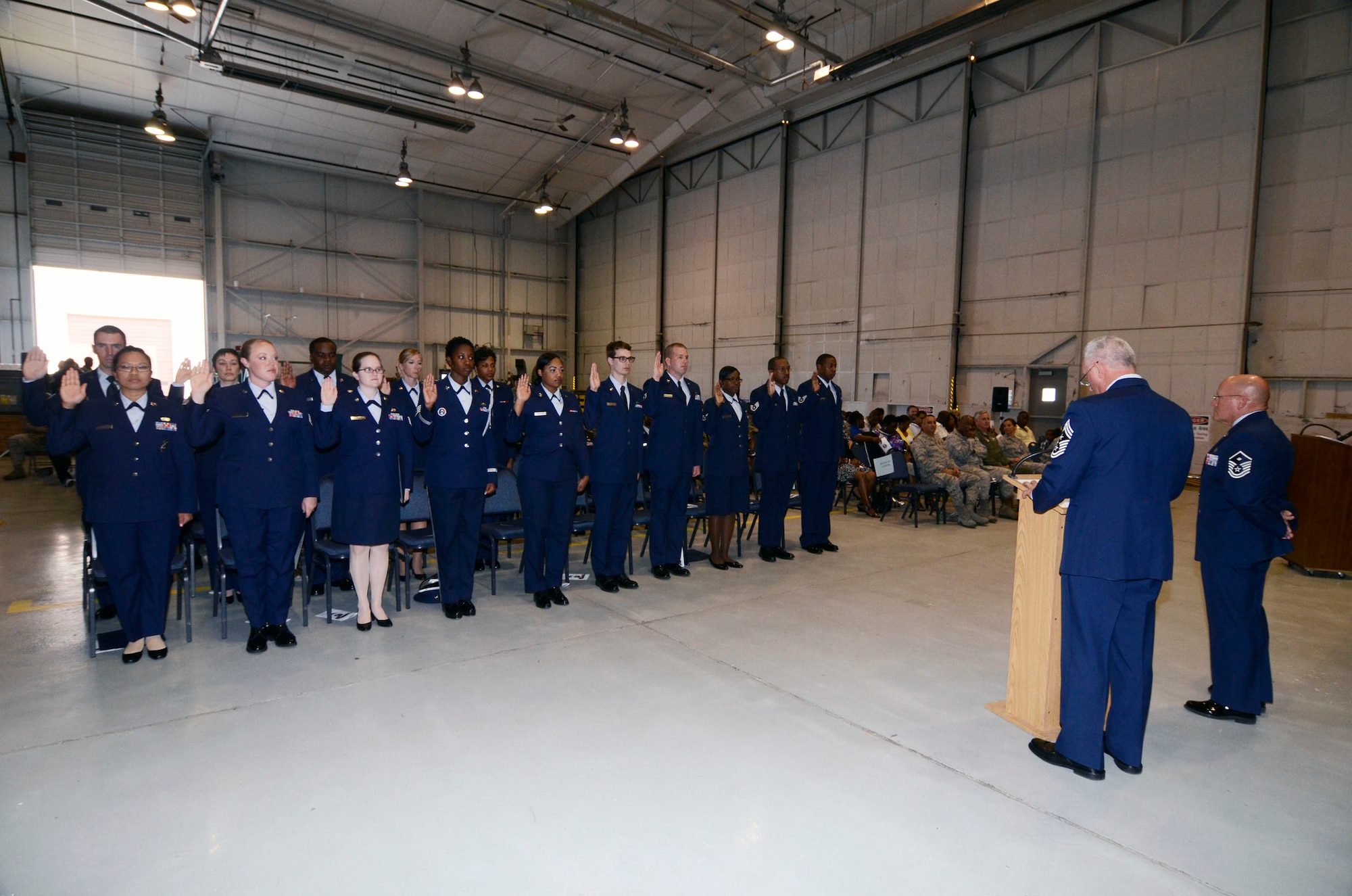 Chief Master Sgt. Wendell L. Peacock, 94th Airlift Wing command chief administers the NCO Charge to those Noncommissioned Officers newly inducted at a ceremony April 14. (U.S. Air Force photo/Don Peek)