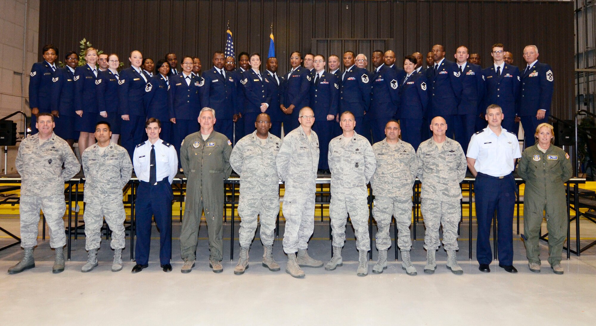 Noncommissioned and Senior Noncommissioned Officers stand together with Wing, Group and Squadron Commanders during an NCO and SNCO Induction Ceremony April 14. (U.S. Air Force photo/Don Peek)