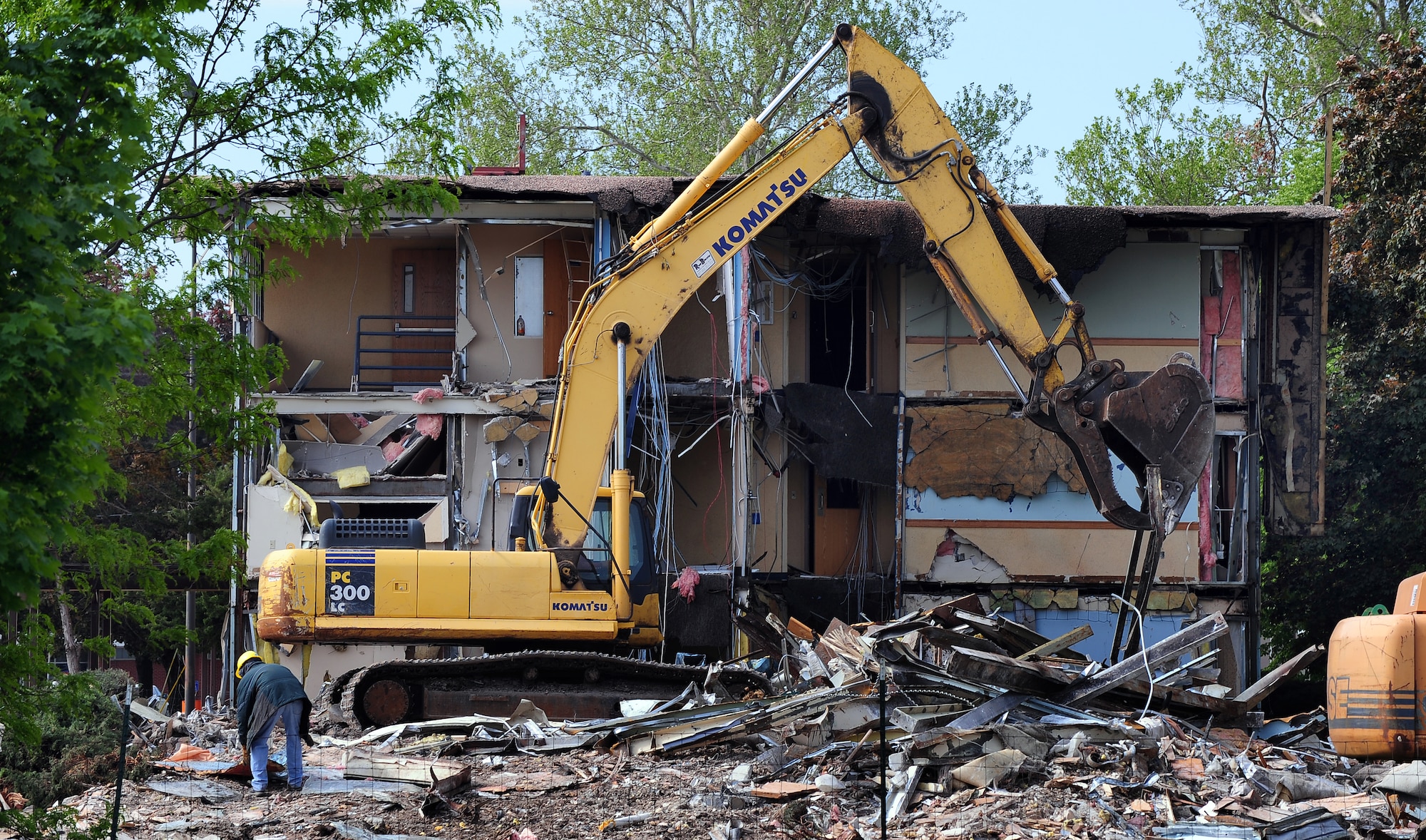 A piece of Offutt history begins to vanish from the landscape as McCoy Hall, a dormitory built in 1952, is demolished at Offutt Air Force Base, Neb., April 17. Throughout its history, the 100 room McCoy Hall was mostly a dormitory for young Airman assigned to base however, for a short spell it was also used as Visiting Airman Quarters. (U.S. Air Force photo by Josh Plueger/Released).