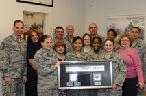 Front: Airman 1st Class Eve McKenzie, Mrs. Anne Owen, Staff Sgt. Odette Wardrip, Staff Sgt. Jessica Delgado, Staff Sgt. Jessica Wyrick and Mrs. Donna Burt.

Back: Chief Master Sgt. Kevin Jurgella, Mrs. Sharon Brown, Mr. Bryce Veasy, Staff Sgt. Caton Todd, Mrs. Jenn Grossman, Lt. Col Jeffrey Cigrang, Staff Sgt. Shameeka McKoy, Capt. Jonathan Doti.

MINOT AIR FORCE BASE, N.D. -- The 5th Medical Operations Squadron's Mental Health Flight has a total of 27 staff members assigned to provide mental health care for all Active-Duty and Active Guard personnel, dependents and retirees here. The clinic's specialties and programs include Mental Health counseling, the Alcohol & Drug Abuse Prevention & Treatment program, the Behavioral Health Optimization Program, the Drug Demand Reduction program, Suicide Prevention, the Family Advocacy Program (including outreach), Psychological Testing, the New Parent Support Program and numerous psycho-educational classes such as stress management, sleep hygiene, anger management, and more. This clinic's work has not gone unnoticed; the Mental Health Flight has been recognized numerous times including in 2008 & 2009 by Air Combat Command, as well as by Air Force Global Strike Command in 2010 as the Category II Outstanding Behavioral Health Team and in 2011 as a part of AFGSC's Biomedical Sciences Corps Team of the Year. (Photo submitted by Tech. Mark Frederici)