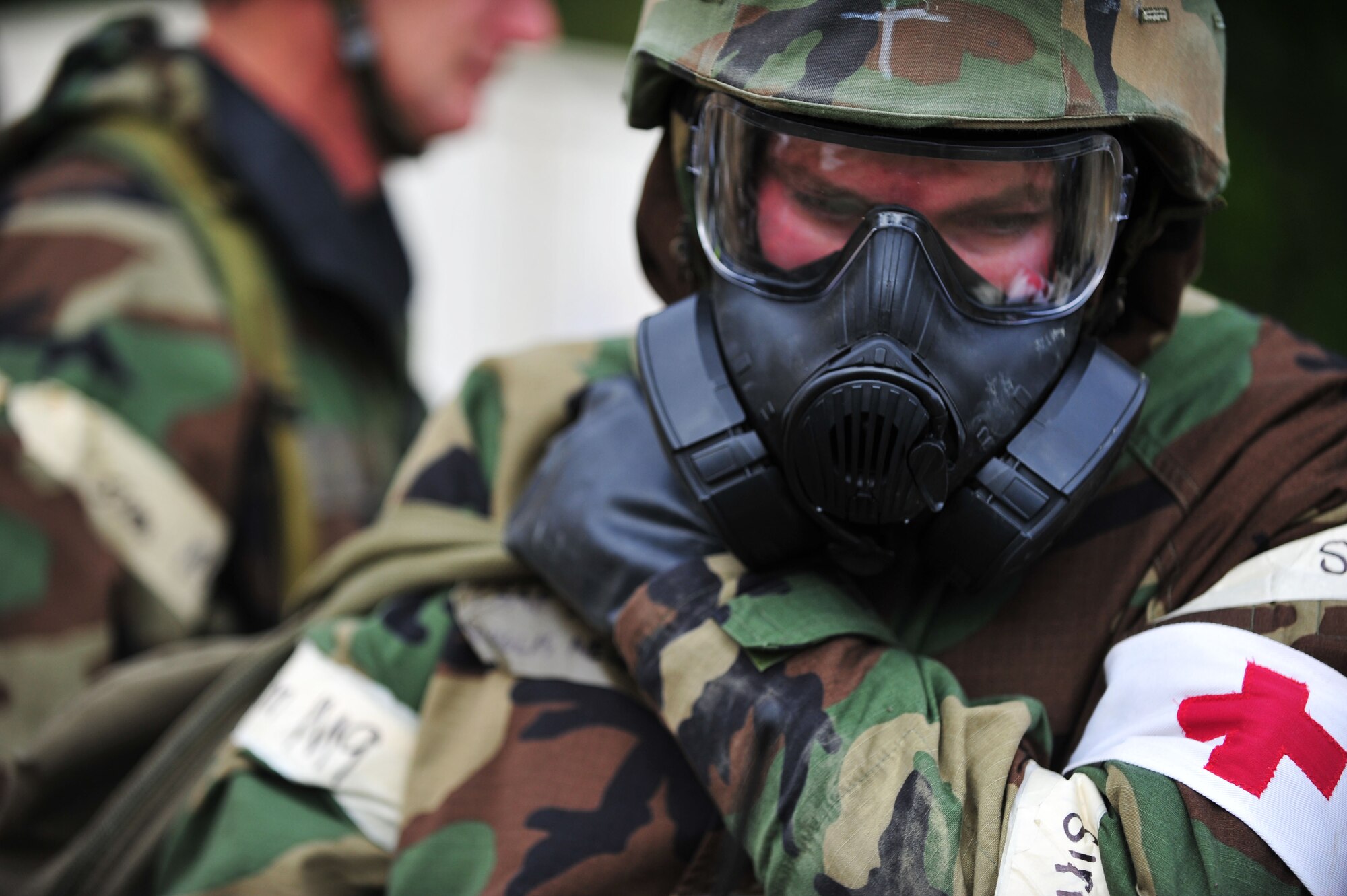 A U.S. Air Force Airman from the 633rd Medical Group prepares to process through a decontamination point during a Phase II Operational Readiness Exercise at Langley Air Force Base, Va., April 20, 2012. Airmen were required to properly de-contaminate if they were suspected of being in contact with simulated-contaminated items. (U.S. Air Force photo by Senior Airman Jarad A. Denton/Released)