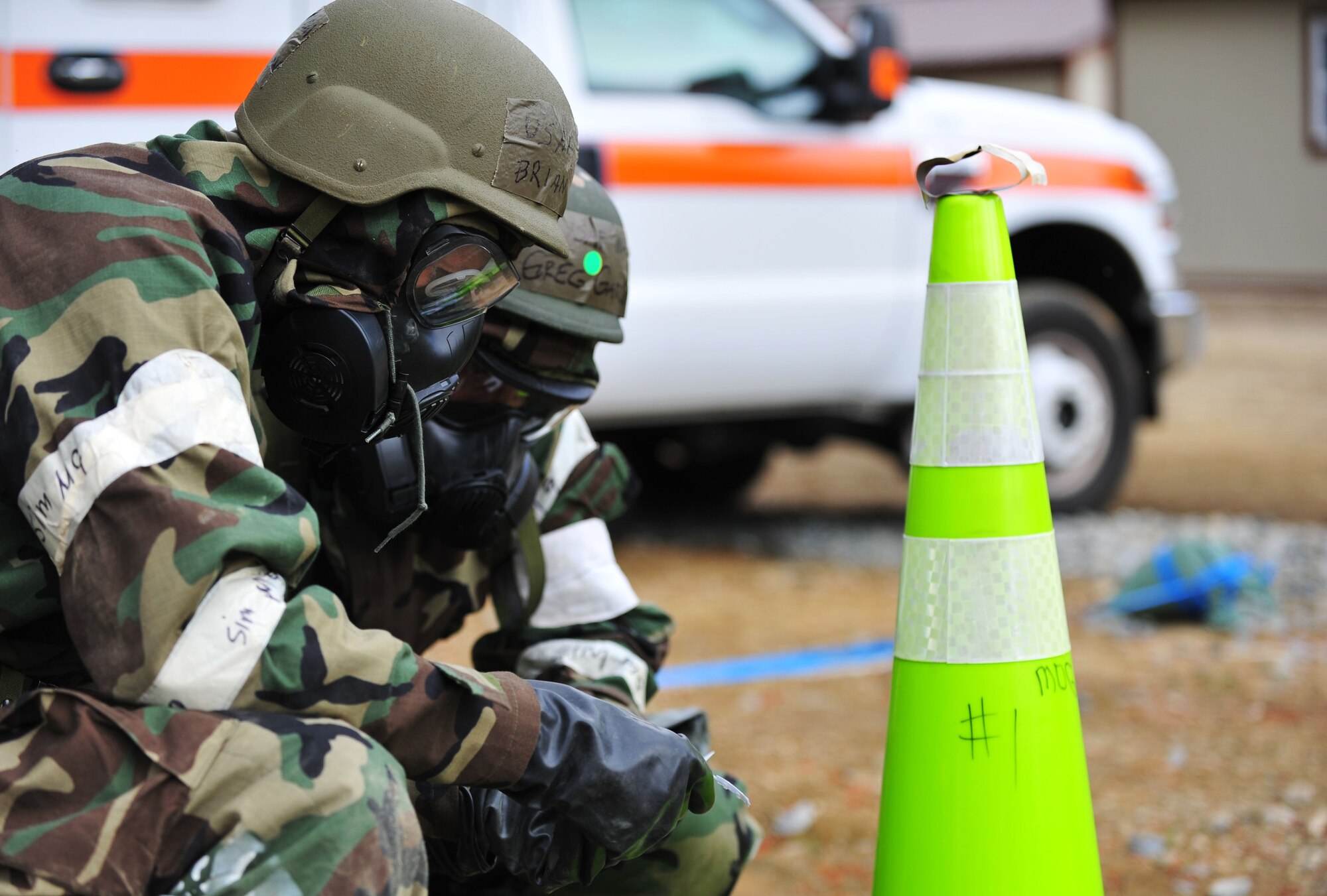 U.S. Air Force Lt. Col. Brian Ortman (front), 1st Fighter Wing Public Health commander, and Maj. Greg Garrison, 633rd Aerospace Medicine Squadron Bio-Environmental Engineering Flight commander, check for contaminated areas as they conduct a post attack reconnaissance sweep during a Phase II Operational Readiness Exercise at Langley Air Force Base, Va., April 20, 2012. The ORE tested Airmen's ability to successfully operate in a simulated combat zone. (U.S. Air Force photo by Senior Airman Jarad A. Denton/Released)