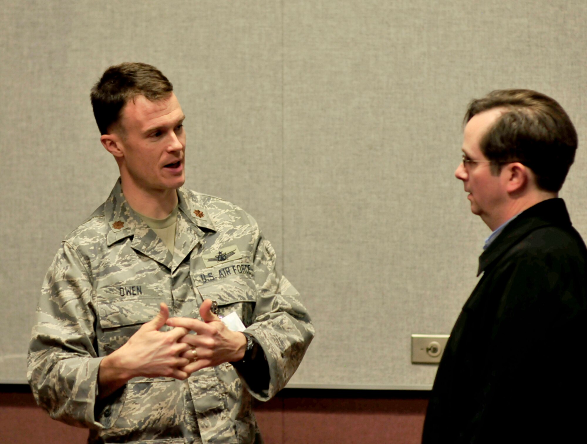 Maj. Zachary Owen, with the Secretary of the Air Force International Affairs Office, answers questions posed by Scott Meredith, senior manager for test facility planning, with AEDC’s capabilities integration branch. (Photo by Jackie Cowan)