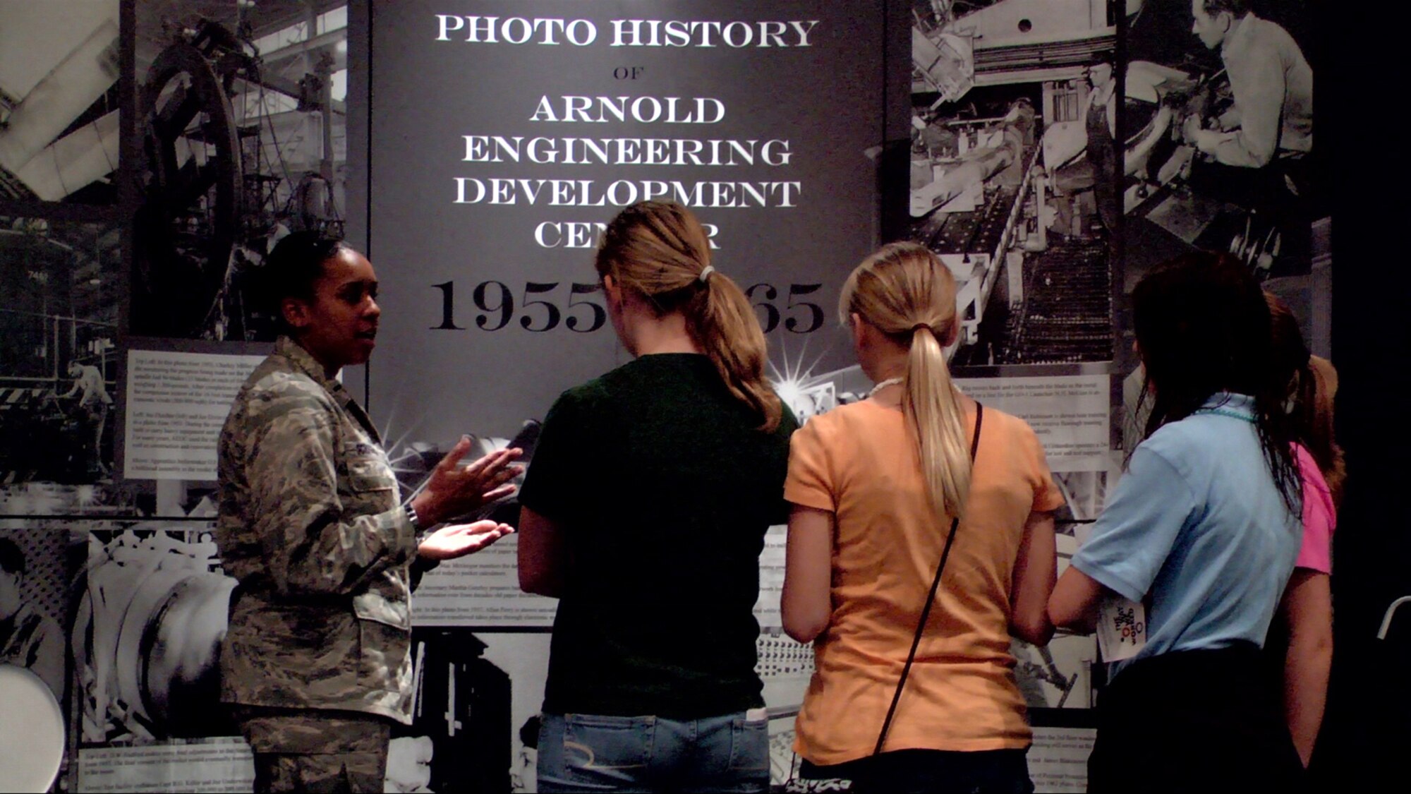 AEDC 1st Lt. Charmeeka Scroggins talks to students about the way work was done at AEDC in the 1950s and 1960s during the Smithsonian Exhibition “The Way We Worked” at the Cowan Railroad museum April 4. AEDC was one of many local landmarks featured during the exhibits visit to Cowan. (Photo by Patrick Ary)