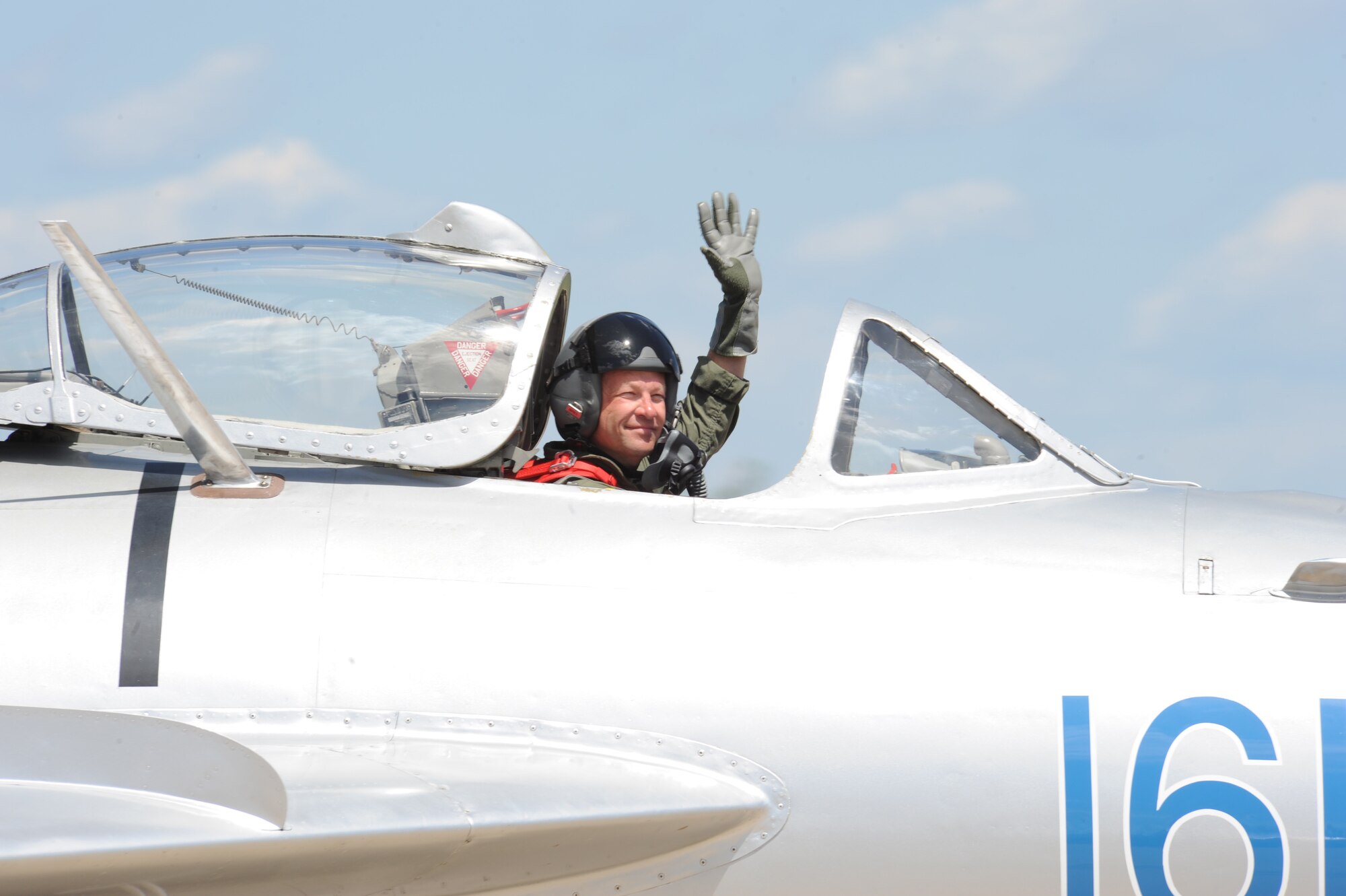 Randy Ball, MiG-17F pilot, greets the crowd after his performance at the 2012 Barksdale Air Force Base Defenders of Liberty Air Show, April 22. The aircraft's agility, power and speed influenced its long use by the Soviet Union from its introduction in the early 1960s until it was pulled from service in 1990. (U.S. Air Force photo/Airman 1st Class Andrew Moua)(RELEASED)
