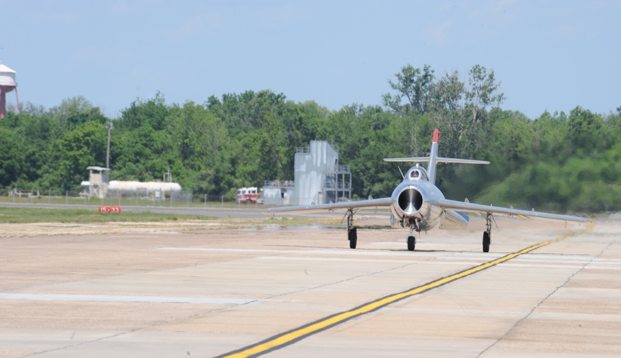 Randy Ball, MiG-17F pilot, taxis down the base flightline after giving an aerial performance at the 2012 Barksdale Air Force Base Defenders of Liberty Air Show, April 22. Due to its maneuverability and great heritage, the MiG-17F is one of the most popular air show jets in the world. (U.S. Air Force photo/Airman 1st Class Andrew Moua)(RELEASED)
