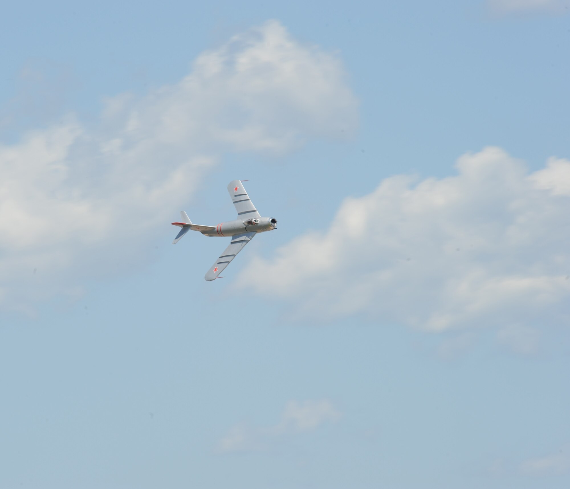 Randy Ball, MiG-17F pilot, banks right in his aircraft as he performs at the 2012 Barksdale Air Force Base Defenders of Liberty Air Show, April 22. In the Korean War era, before the F-16 Fighting Falcon was introduced into U.S. service, the MiG-17F was the tightest turning aircraft in the world. (U.S. Air Force photo/Airman 1st Class Andrew Moua)(RELEASED)
