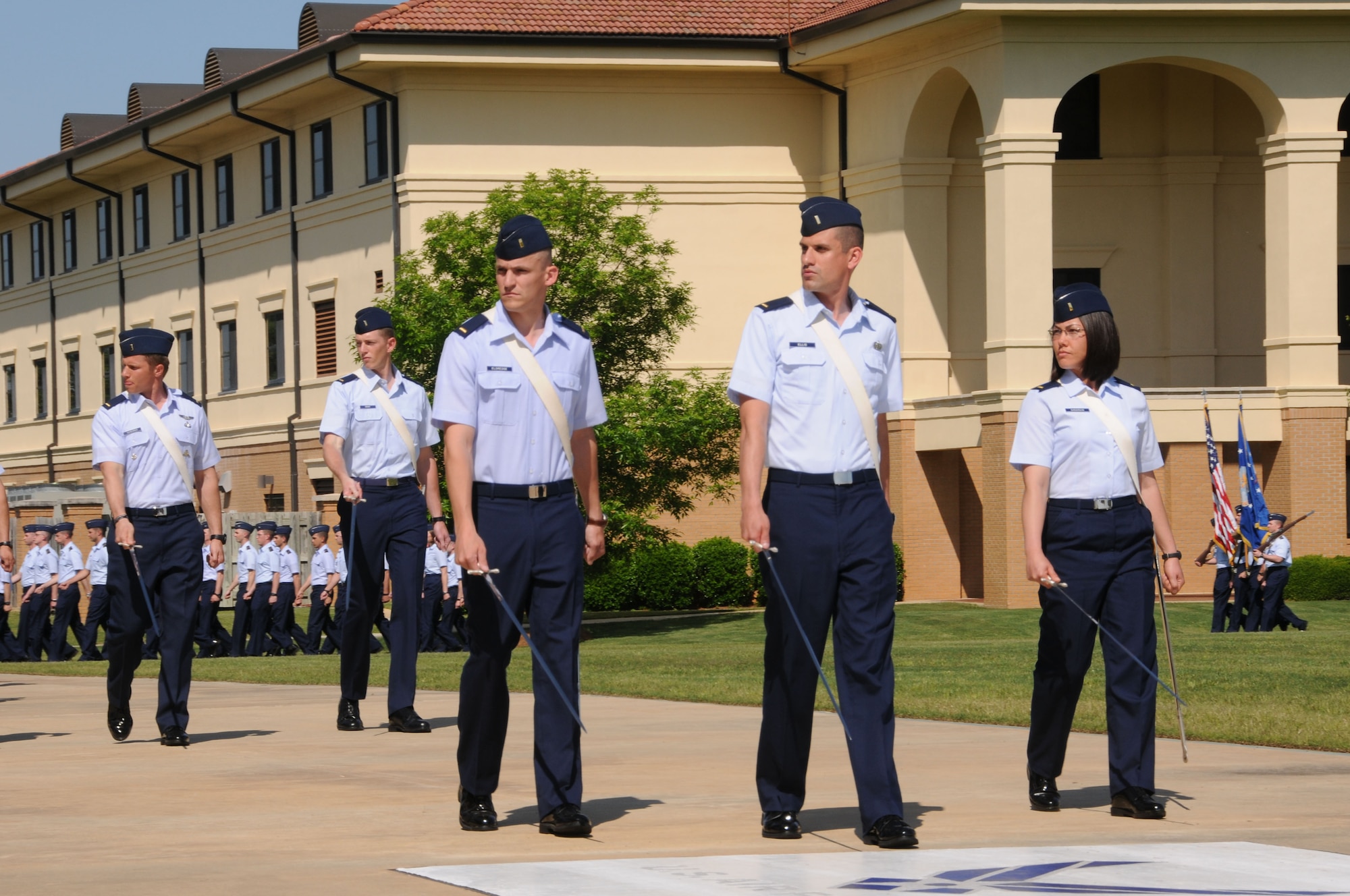 Officer Training School held a graduation parade for the Basic Officer Training Course, Class 12-04, April 10, reviewed by Lt. Gen. David Fadok, commander and president of the Air University. Basic Officer Training prepares and commissions second lieutenants to fulfill Air Force active-duty and Air Force Reserve requirements in partnership with the U.S. Air Force Academy and Air Force Reserve Officer Training Corps. The training consists of 12 weeks of military instruction and leadership development for college graduates leading to a commission as a second lieutenant. BOT is designed to instill high standards of conduct and provide officer candidates with the essential military knowledge and skills needed for effective performance as Air Force leaders. There are seven BOT classes per fiscal year. (Air Force photo by Bud Hancock)