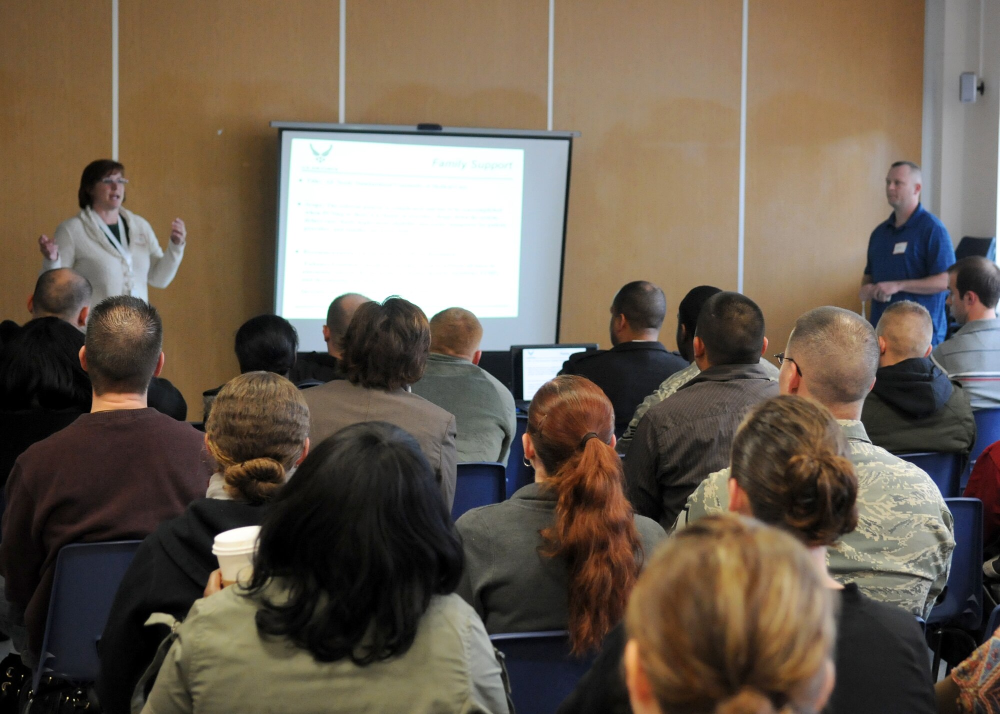 RAF MILDENHALL, England – Volunteers from the family support working group brief other base members about the top issues that were brought up in their group at the conclusion of the Caring for People Forum at the RAF Mildenhall Chapel April 17, 2012. During the forum, military members, civilians, spouses and retirees shared ideas about improving Air Force quality of life programs and activities for Airmen and family members. (U.S. Air Force photo/Staff Sgt. Tabitha M. Lee)