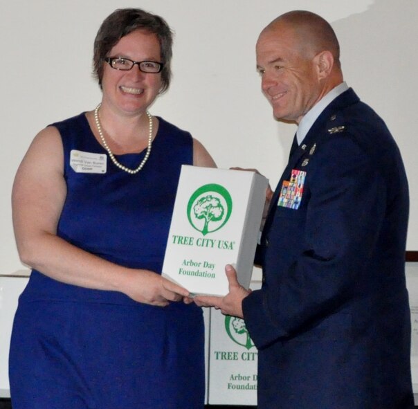 Colonel Daniel Semsel, 88th Air Base Vice Wing Commander, accepts the Tree City USA Award on behalf of Wright-Patterson Air Force Base from Wendi Van Buren, Ohio Department of Division of Forestry, at the awards ceremony luncheon in Amberely Village on April 20, 2012.  This marks the 15 year the base has earned the award. (U.S. Air Force photo by Ted Theopolos)