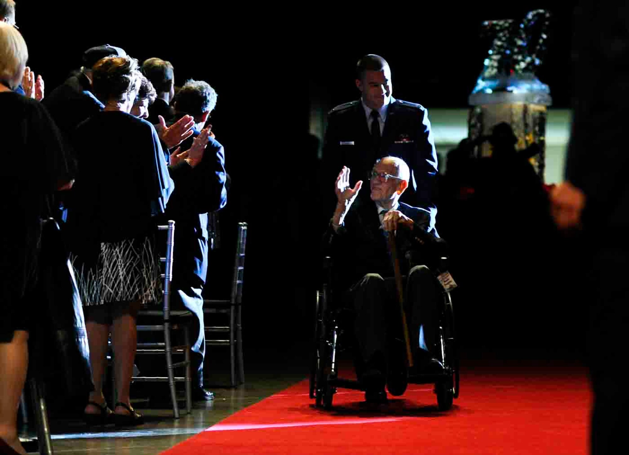 Surviving Doolittle Raider Major Thomas C. Griffin, navigator of the #9 plane, greets attendees of a banquet to honor the Raiders during their 70th reunion at the National Museum of the U.S. Air Force, April 19, 2012.  (U.S. Air Force photo by Tech. Sgt. Bennie J. Davis III)