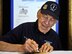 Lt. Col.  Richard E. Cole co-pilot of Gen. Jimmy Doolittle's B-25 plane #1, signs autographs during a meet and greet with the raiders for their 70th reunion, April 19 at the Hope Hotel, Fairborn, Ohio. At 96, Cole is the oldest of the remaining five Raiders and says the attention they receive still surprises him. (U.S. Air Force photo by Tech. Sgt. Bennie J. Davis III)