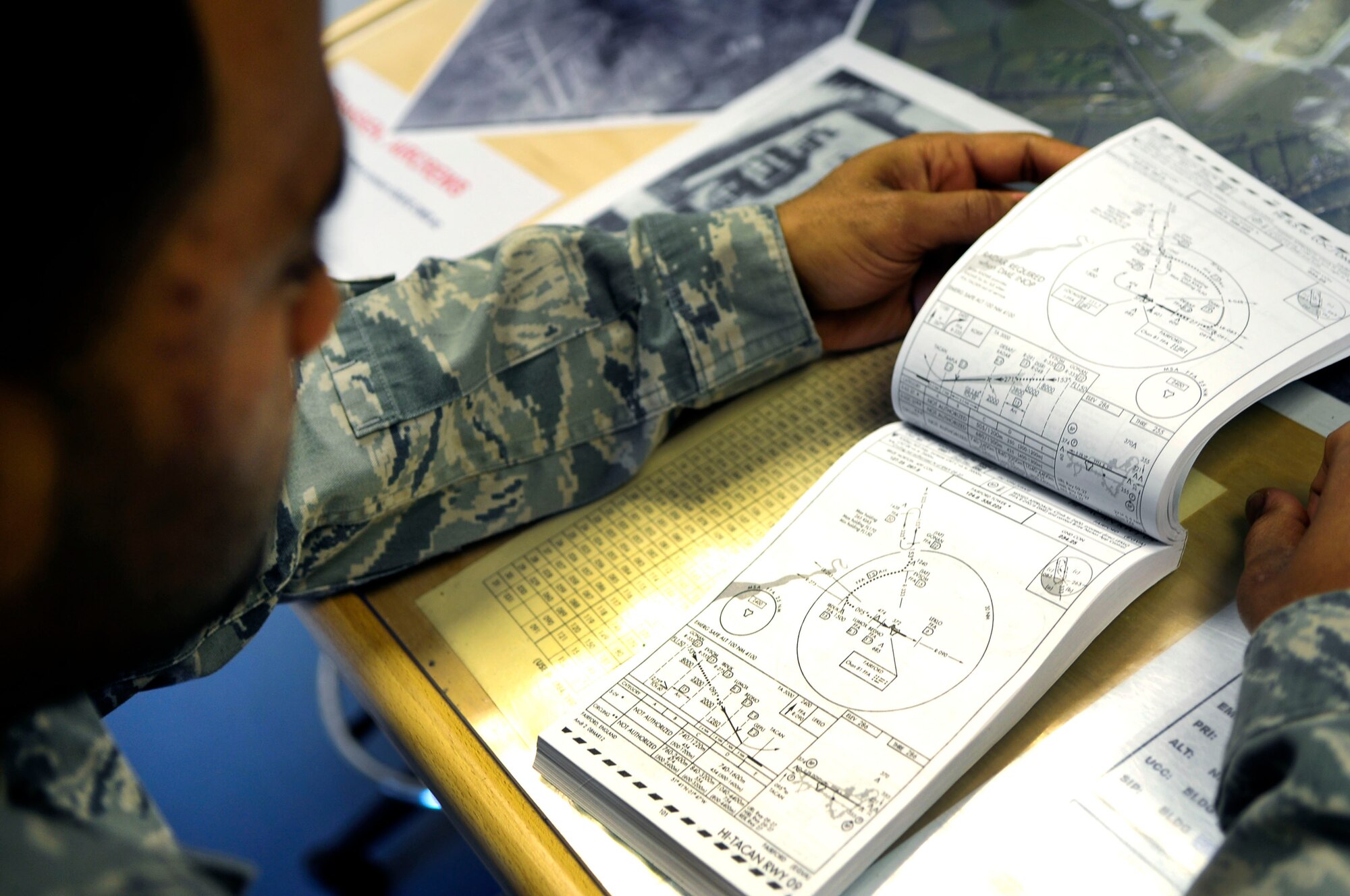 Staff Sgt. Andrew Mimms, 435th Air Mobility Squadron air traffic controller, reviews aircraft approach procedures at RAF Fairford, England, April 20, 2012. Mimms is a member of the advanced echelon team, or ADVON, that traveled to Fairford, England, in preparation for the 37th Airlift Squadron’s off-station training scheduled to begin April 23. (U.S. Air Force photo/Senior Airman Katherine Holt)