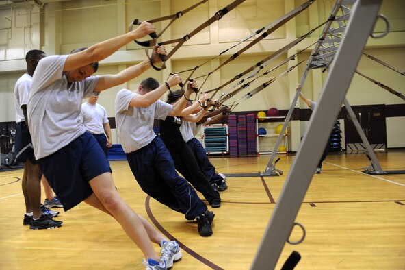 Physical training leaders from the 4th Fighter Wing learn core exercises during a Total Body Resistance Exercise and Suspension Training course at the base fitness center on Seymour Johnson Air Force Base, N.C., April 19, 2012. Core strength and stability are vital to physical performance and injury prevention. (U.S. Air Force photo/Staff Sgt. Courtney Richardson/Released)