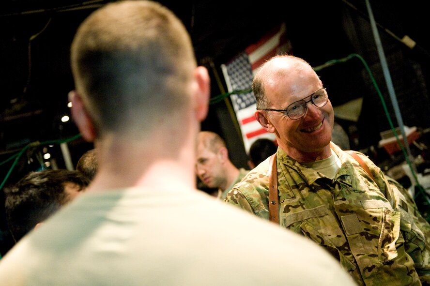 U.S. Air Force Lt. Col. James Routt with the 550th Special Operations Squadron, shares a laugh with his crew on the last combat mission of his career, Bagram Air Field, Afghanistan, April 12, 2012. Routt is currently the oldest active duty pilot in the Air Force and is augmenting for the 71st Expeditionary Rescue Squadron. The mission of the 71st ERQS is to provide personnel recovery, casualty evacuation and aeromedical evacuation assets from hostile locations. The 71st ERQS is the only fixed wing aircraft squadron dedicated to medical evacuation missions in Afghanistan. (U.S. Air Force photo by Staff Sgt. Greg C. Biondo)