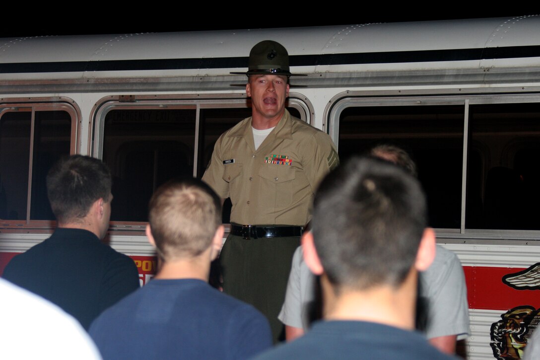 Staff Sgt Justin L. Hansen, chief drill instructor, Receiving Company, Recruit Training Regiment, instructs new recruits how to stand at the position of attention April 23 aboard Marine Corps Recruit Depot San Diego. The first step in recruit training is the Receiving, which is a 24-hour process that sets up the recruits for their training and the rest of their time aboard the depot.