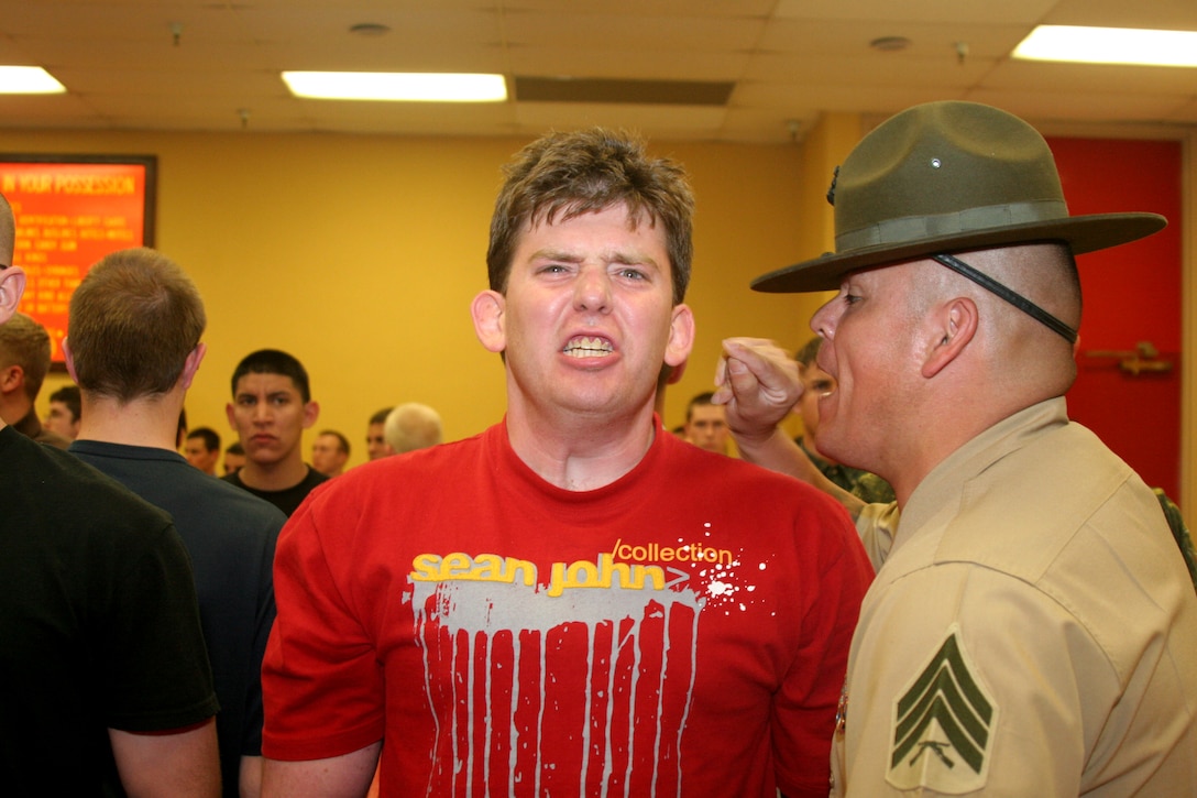 Sgt. Michael Bachicha, senior drill instructor, Receiving Company, Recruit Training Regiment, corrects a recruit in the contraband room during receiving April 23 aboard Marine Corps Recruit Depot San Diego. Drill instructors of Receiving Co. give the recruits an idea of what the rest of their time aboard the depot will be like.