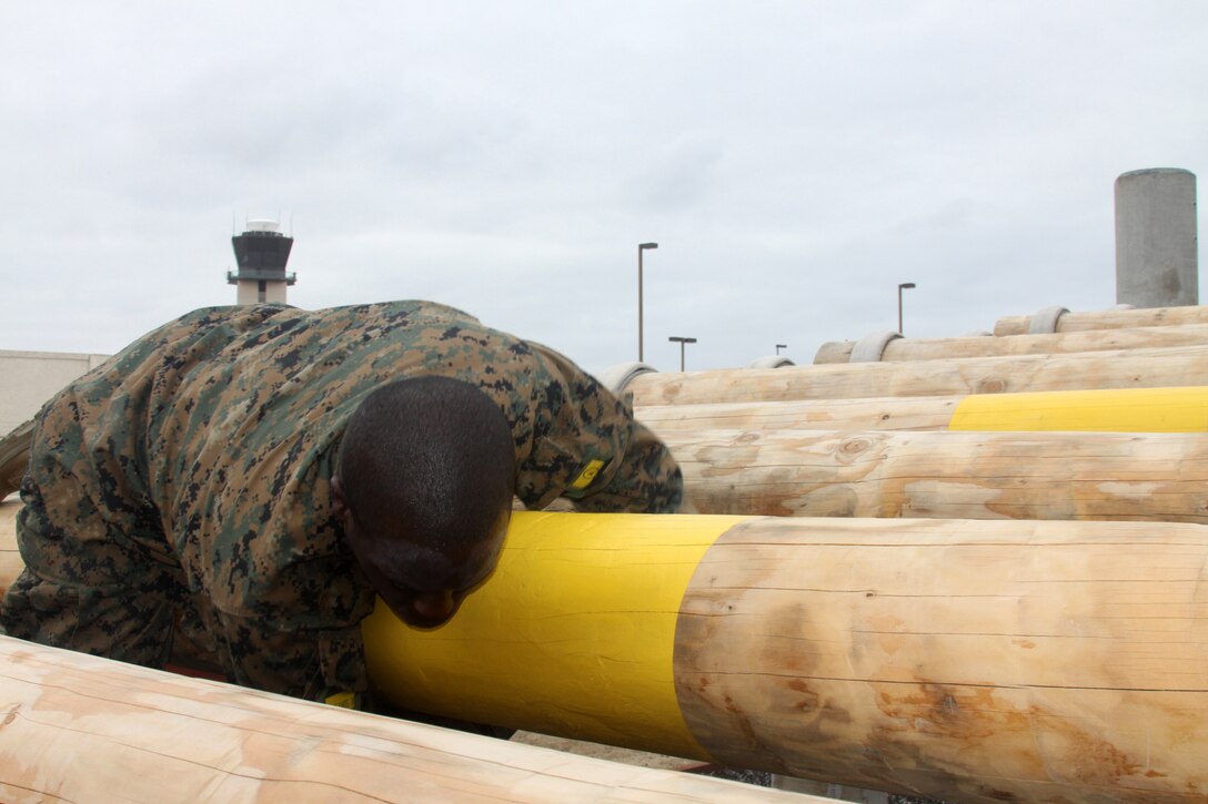 Company H recruits weave through logs April 23 aboard Marine Corps Recruit Depot San Diego. This was one of 12 obstacles that made up the Confidence Course for Co. H during their third week of recruit training. Next week they will take on three additional obstacles that are much heigher. This will force recruits with a fear of heights to overcome their fear and gain confidence.