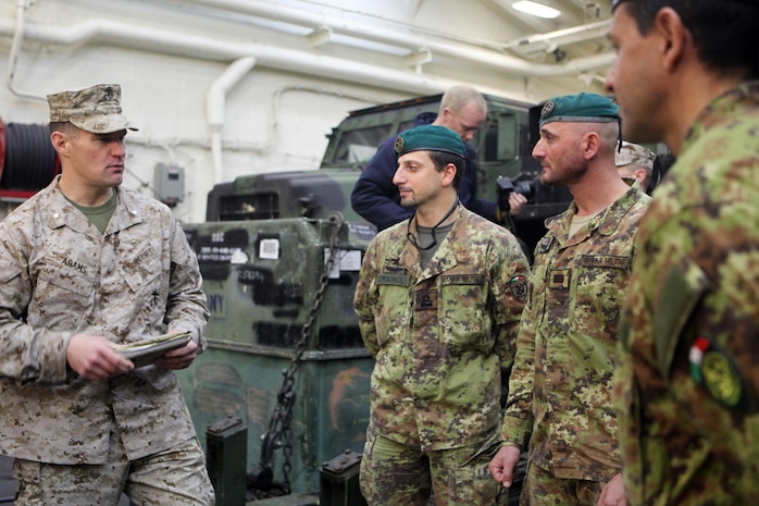 USS NEW YORK -- Lt. Col. Aaron Adams, 24th Marine Expeditionary Unit executive officer, greets members of the Gruppo Operativo Incursori, the Italian equivalent of U.S. Navy SEALs, here, during a port visit in La Spezia, Italy, April 23, 2012. The 24th MEU along with the Navy's Iwo Jima Amphibious Ready Group, is currently deployed as a theater reserve and crisis response force capable of a variety of missions from full-scale combat to humanitarian assistance and disaster relief. (Official Marine Corps Photo by Staff Sgt. Robert L. Fisher III)