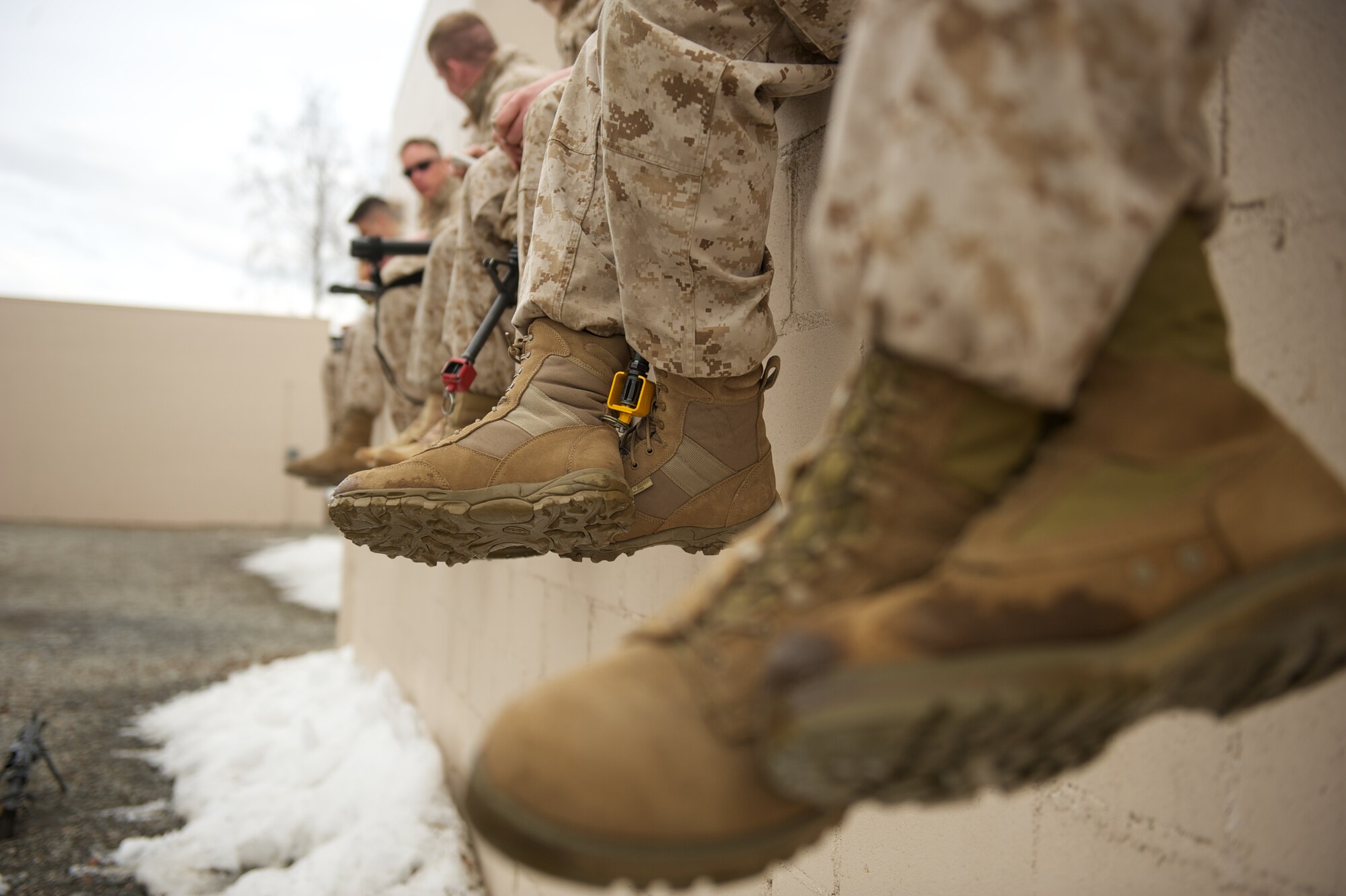 JOINT BASE ELMENDORF-RICHARDSON, Alaska -- Marines of D Company, Anti-Terrorism Battalion, take a break April 21 during training in urban operations at JBER's Baumeister City MOUT Complex. (U.S. Air Force photo/David Bedard)