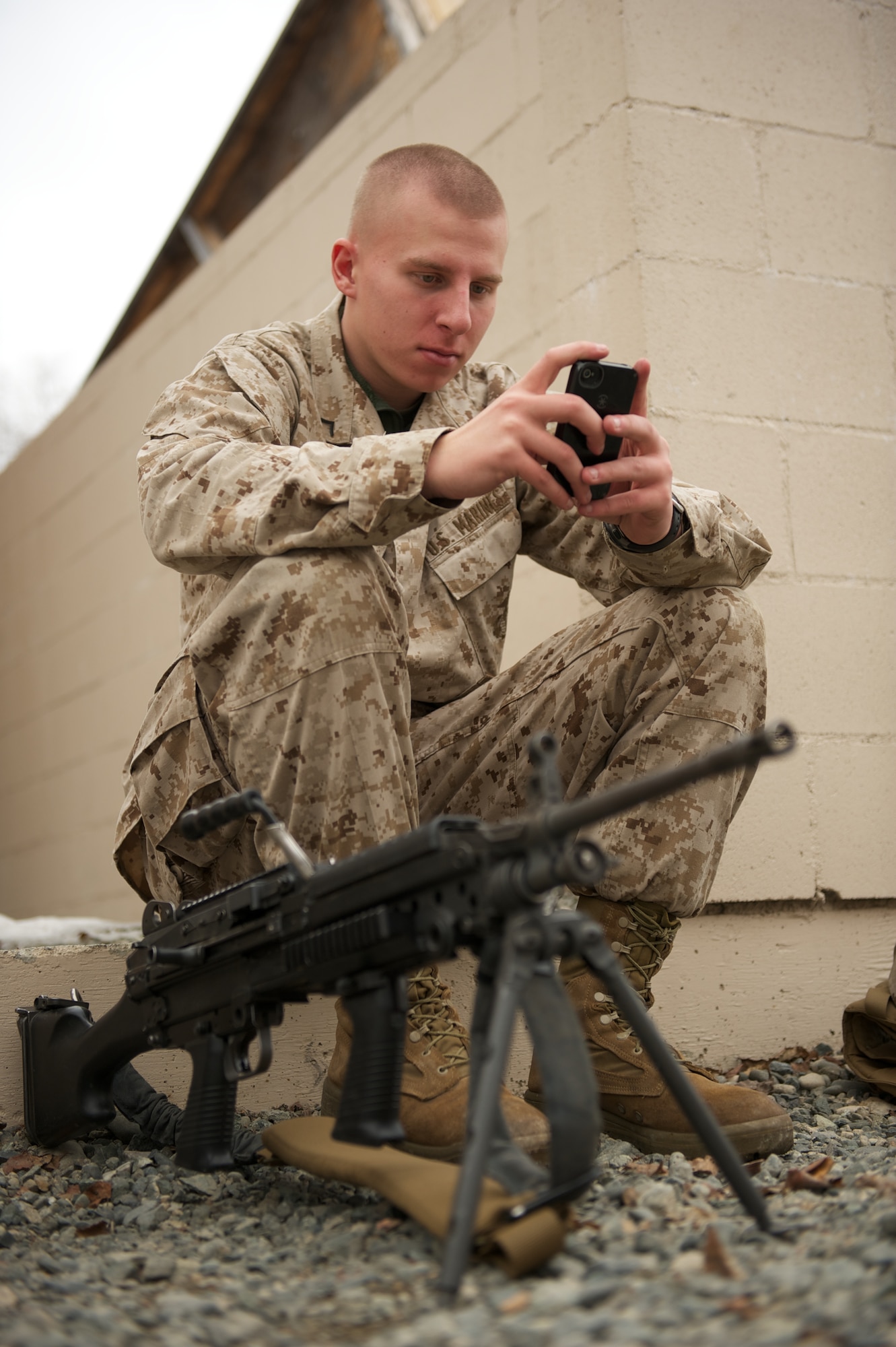 JOINT BASE ELMENDORF-RICHARDSON, Alaska -- Marine Pfc. Trevor Reagan, D Company, Anti-Terrorism Battalion, of Anchorage, takes a break April 21 during training in urban operations at JBER's Baumeister City MOUT Complex. (U.S. Air Force photo/David Bedard)