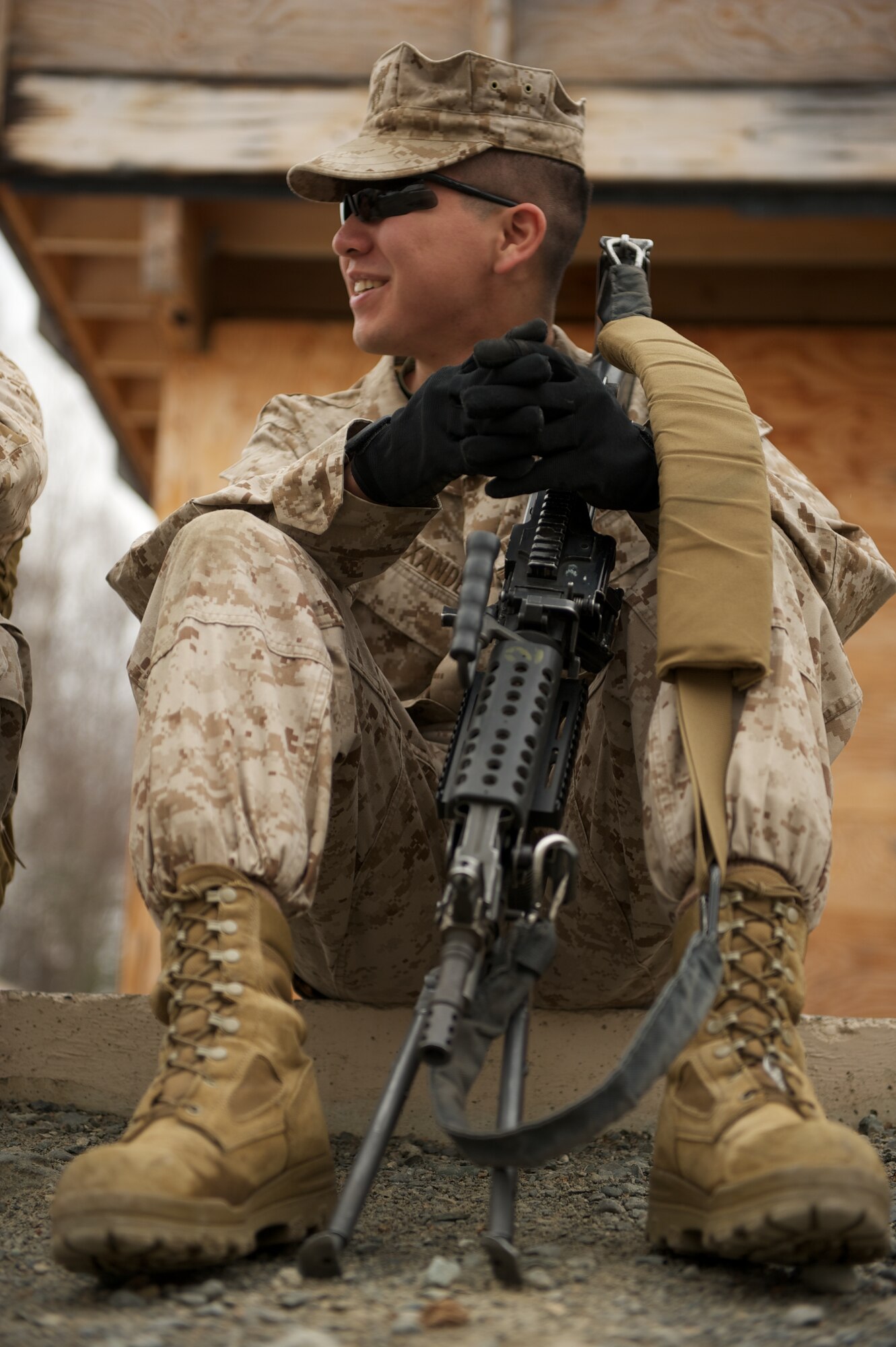 JOINT BASE ELMENDORF-RICHARDSON, Alaska -- Lance Cpl. Matthew Alexander, D Company, Anti-Terrorism Battalion, of Anchorage, takes a break April 21 during training in urban operations at JBER's Baumeister City MOUT Complex. (U.S. Air Force photo/David Bedard)