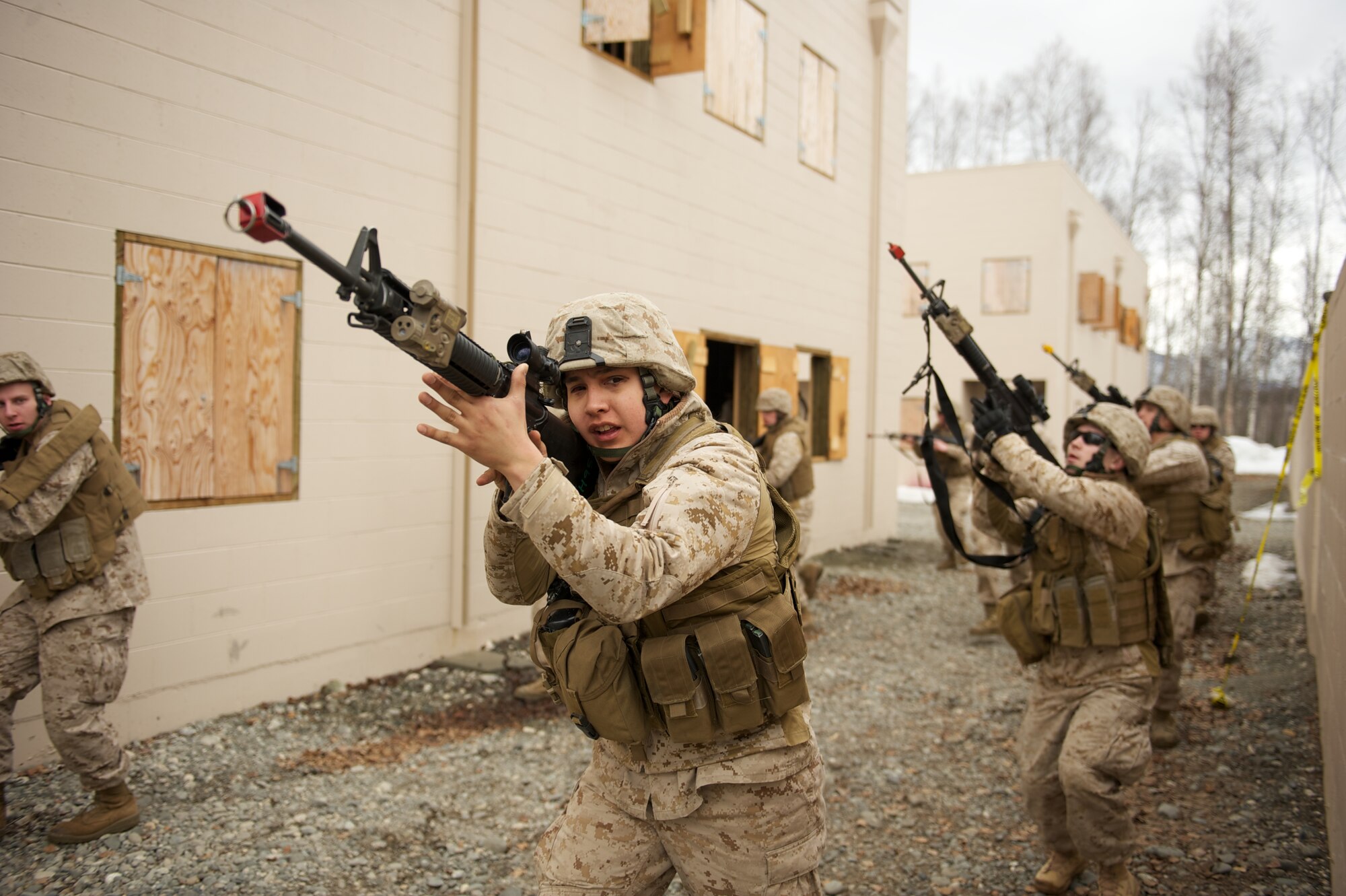 JOINT BASE ELMENDORF-RICHARDSON, Alaska -- Lance Cpl. Jared Palmer, D Company, Anti-Terrorism Battalion, maneuvers at the head of a squad April 21 during training in urban operations at JBER's Baumeister City MOUT Complex. (U.S. Air Force photo/David Bedard)