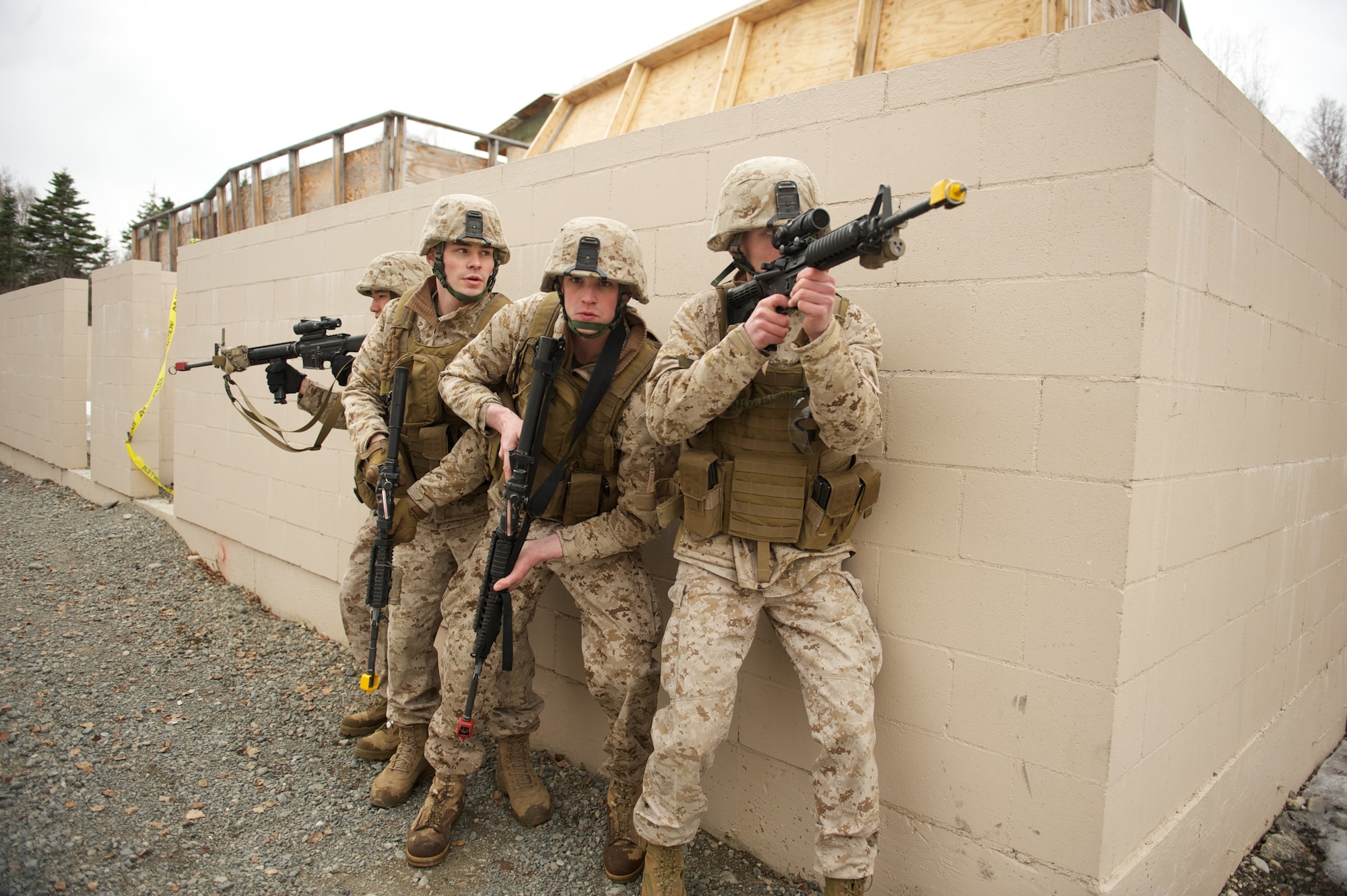 JOINT BASE ELMENDORF-RICHARDSON, Alaska -- A squad of D Company, Anti-Terrorism Battalion Marines form up April 21 during training in urban operations at JBER's Baumeister City MOUT Complex. (U.S. Air Force photo/David Bedard)