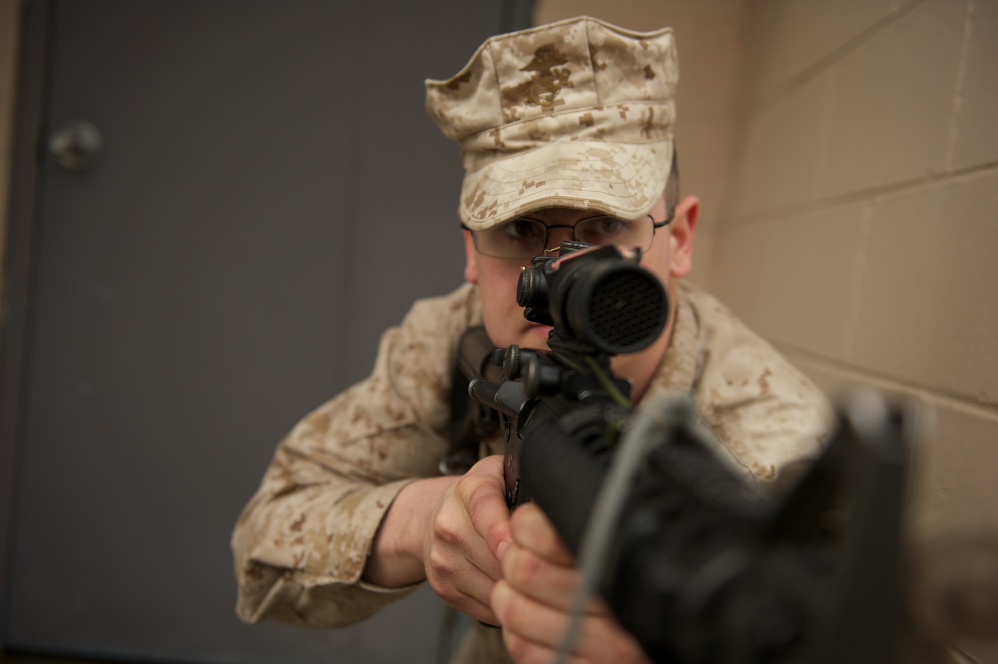 JOINT BASE ELMENDORF-RICHARDSON, Alaska -- Lance Cpl. Grant Badgerroberts of Palmer, D Company, Anti-Terrorism Battalion, provides security April 21 during training in urban operations at JBER's Baumeister City MOUT Complex. (U.S. Air Force photo/David Bedard)