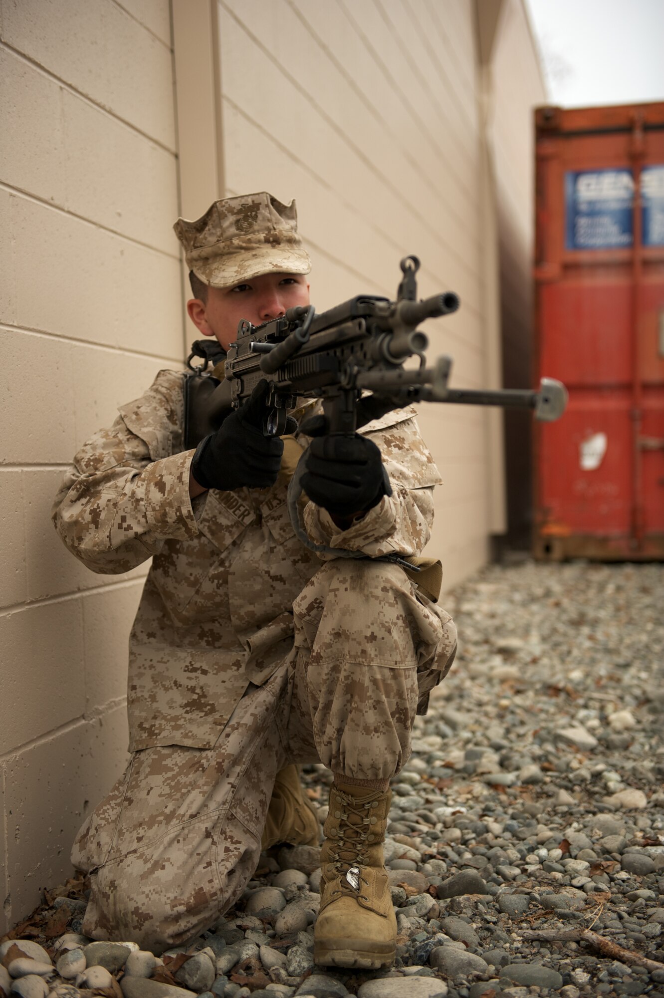 JOINT BASE ELMENDORF-RICHARDSON, Alaska -- Lance Cpl. Matthew Alexander, D Company, Anti-Terrorism Battalion, of Anchorage, provides security April 21 during training in urban operations at JBER's Baumeister City MOUT Complex. (U.S. Air Force photo/David Bedard)