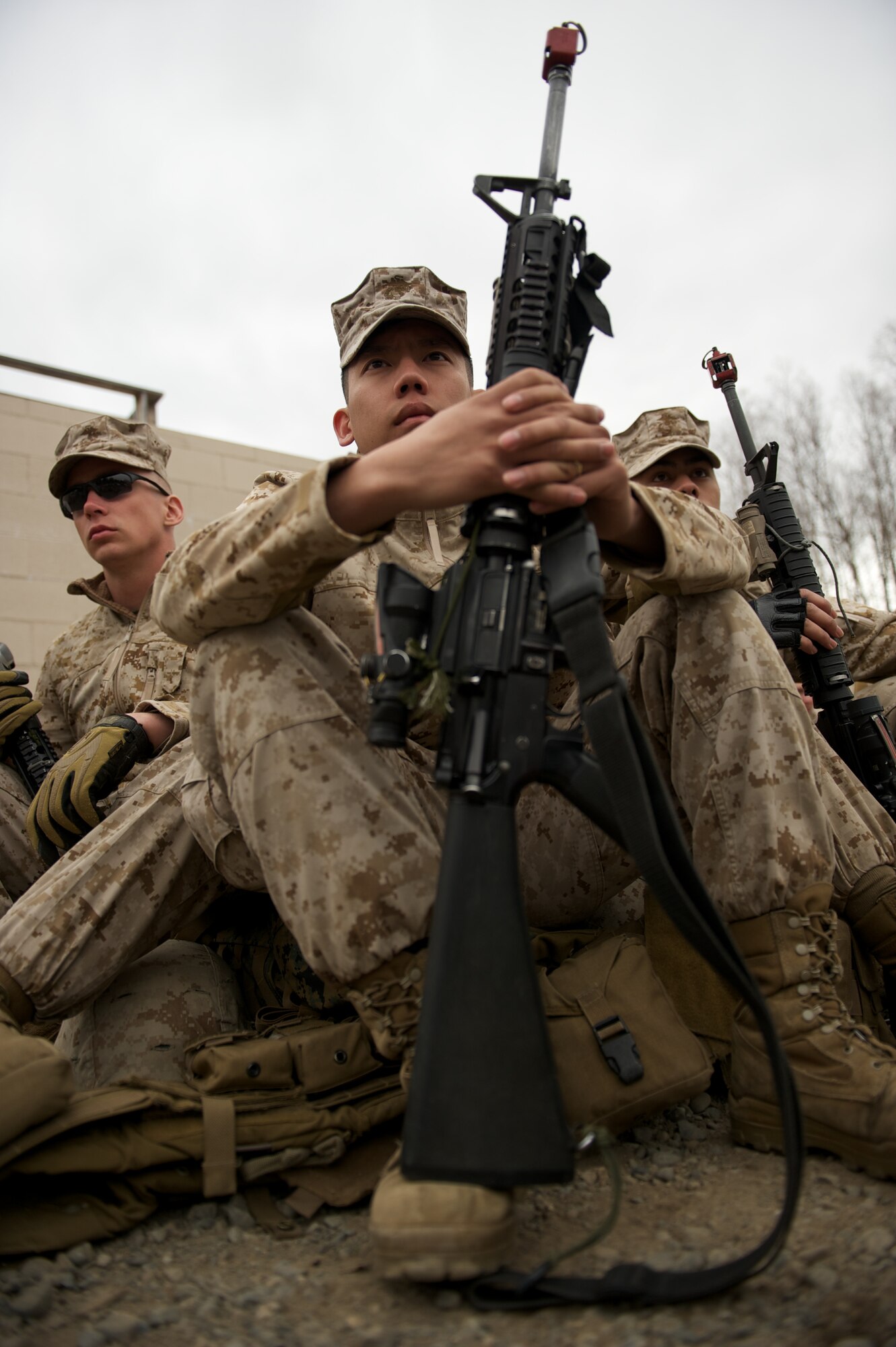 JOINT BASE ELMENDORF-RICHARDSON, Alaska -- Lance Cpl. Steven Lee, D Company, Anti-Terrorism Battalion, of Sacramento, Calif., listens to instructions April 21 before training in urban operations at JBER's Baumeister City MOUT Complex. (U.S. Air Force photo/David Bedard)