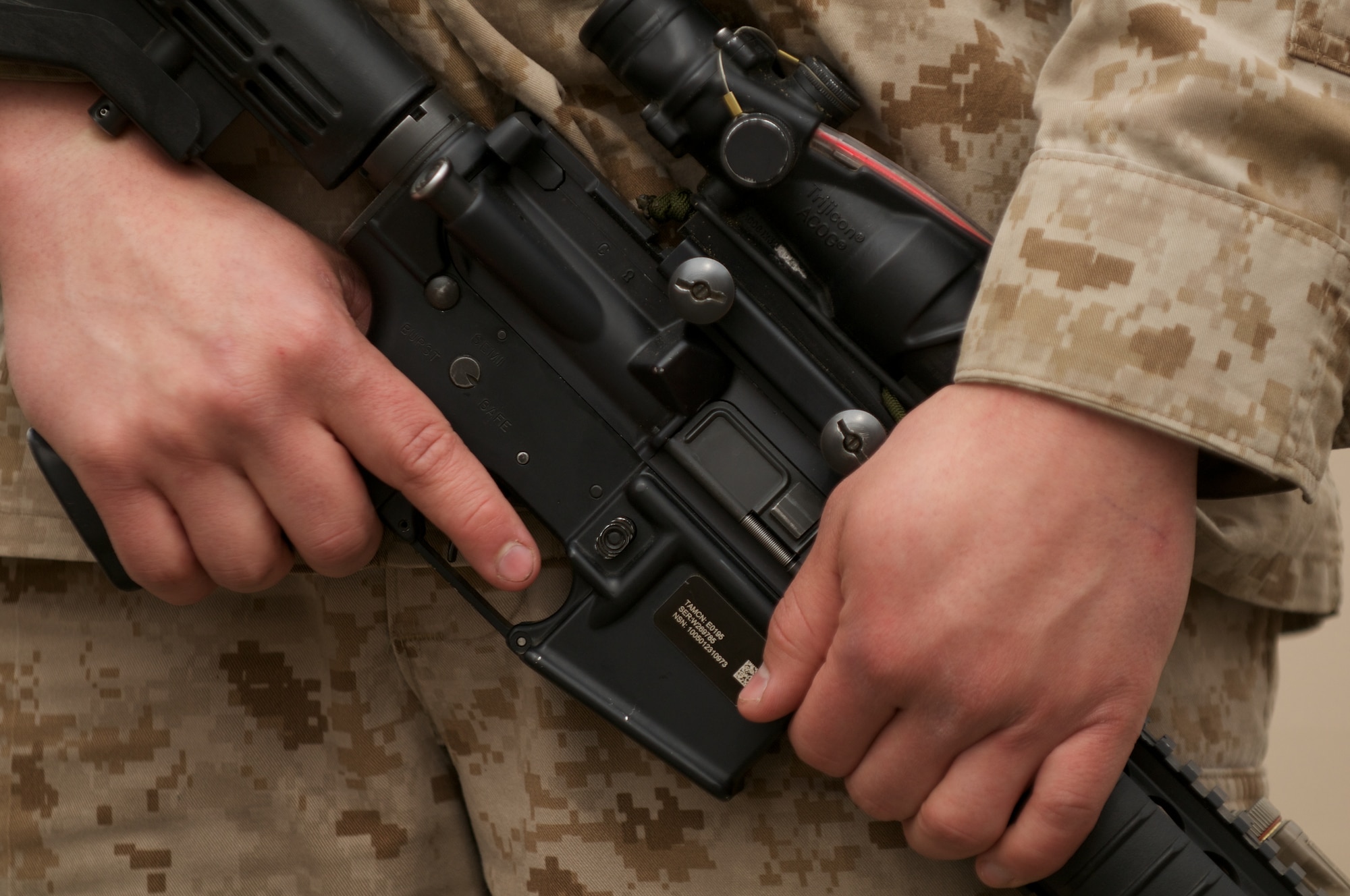 A D Company, Anti-Terrorism Battalion Marine cradles his rifle during training for military operations in urban terrain April 21 at Baumeister City MOUT complex. (U.S. Air Force photo/David Bedard)