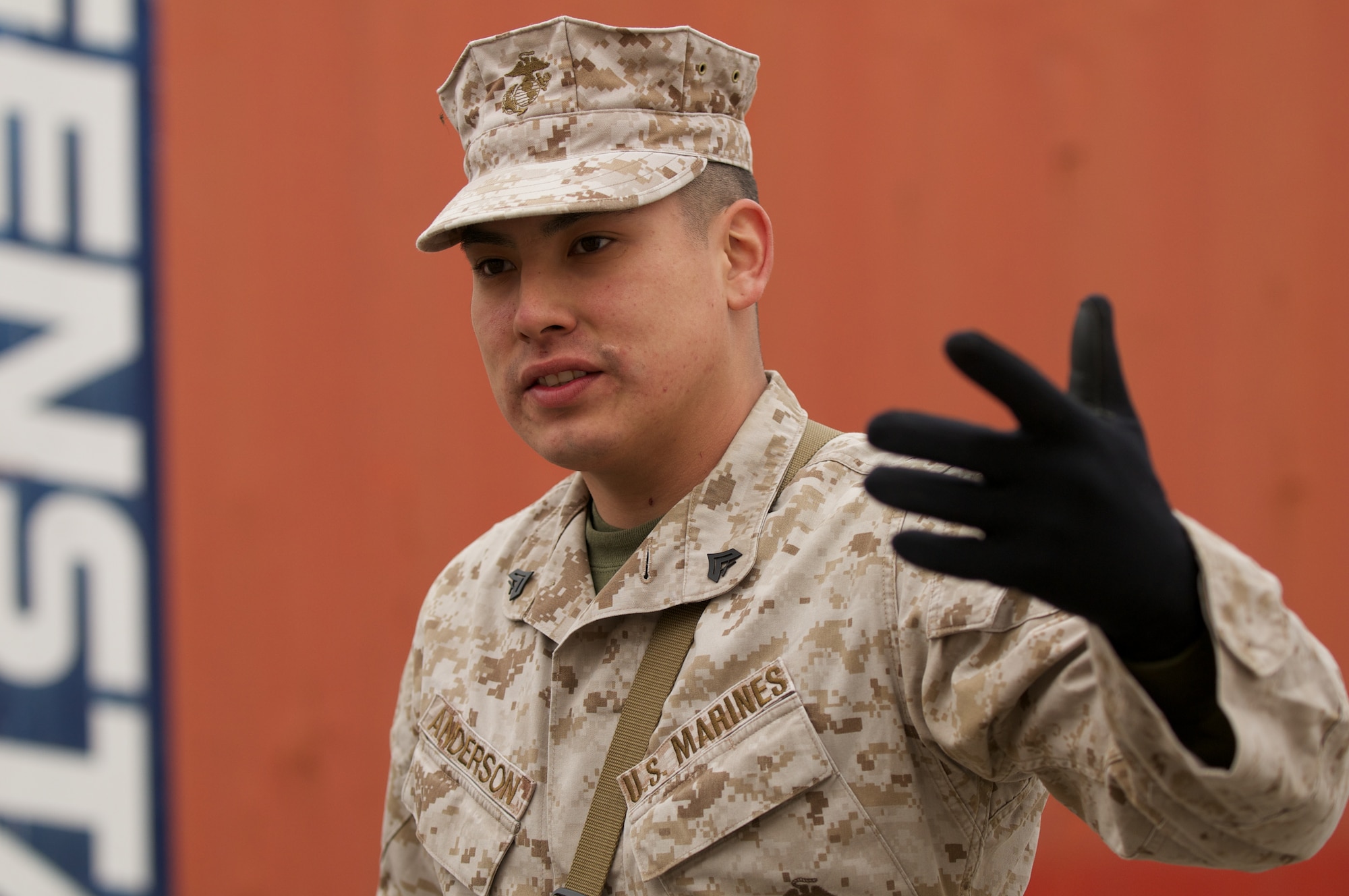JOINT BASE ELMENDORF-RICHARDSON, Alaska -- Marine Cpl. Edwin Anderson IV, D Company, Anti-Terrorism Battalion, talks to his squad April 21 during urban operations at JBER's Baumeister City MOUT Complex. (U.S. Air Force photo/David Bedard)