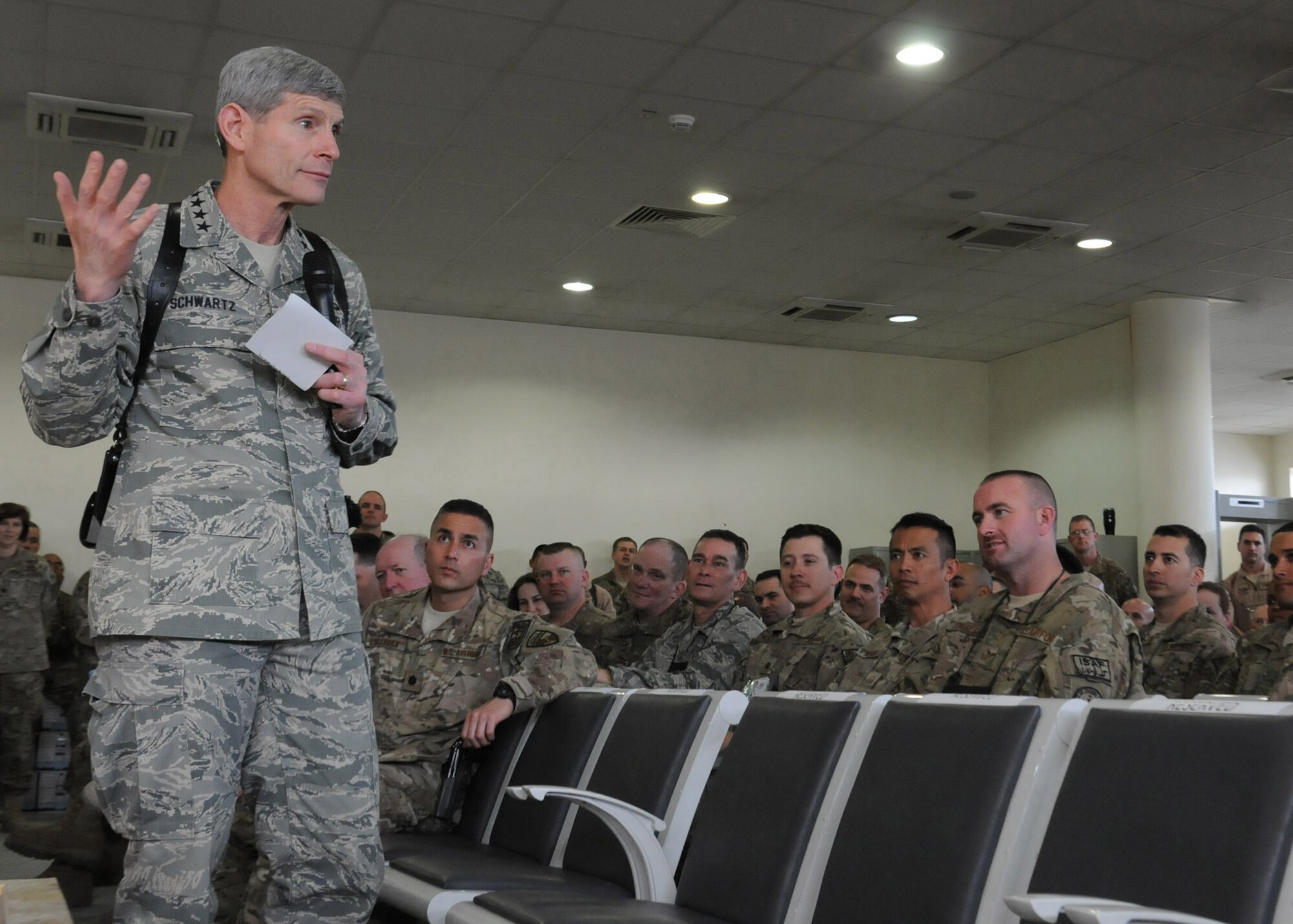 Air Force Chief of Staff Gen. Norton Schwartz talks with Airmen from the 438th Air Expeditionary Wing and the International Security Assistance Force Joint Command April 23, 2012, during his visit to Kabul International Airport, Afghanistan. The general discussed resiliency issues effecting today?s Airmen and their families, changes in service capabilities, and Air Force budget priorities. (U.S. Air Force photo/Staff Sgt. Nadine Y. Barclay)