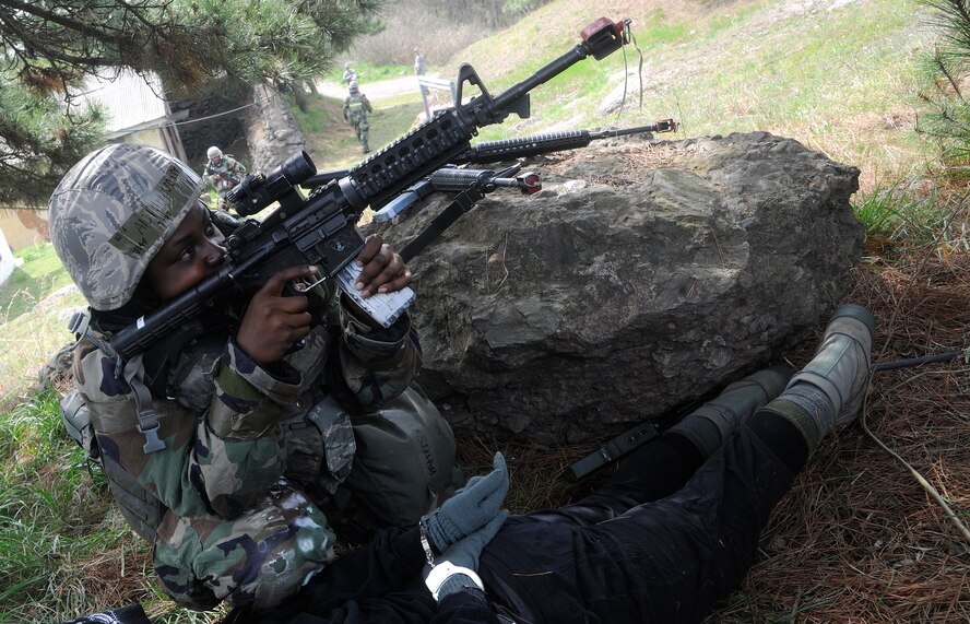 Airman First Class Daneisha Patterson, 8th Security Forces Squadron member, provides suppressive fire during a mock firefight with opposing forces as part of the operational readiness exercise at Kunsan Air Base, Republic of Korea, April 24, 2012. BEVERLY MIDNIGHT 12-02 is the last phase of inspections by the Pacific Air Forces Inspector General Team.  The Wolf Pack will find out the inspection results on May 2 after the IG Team has finalized their report. (U.S. Air Force photo/Staff Sgt. Rasheen A. Douglas)
