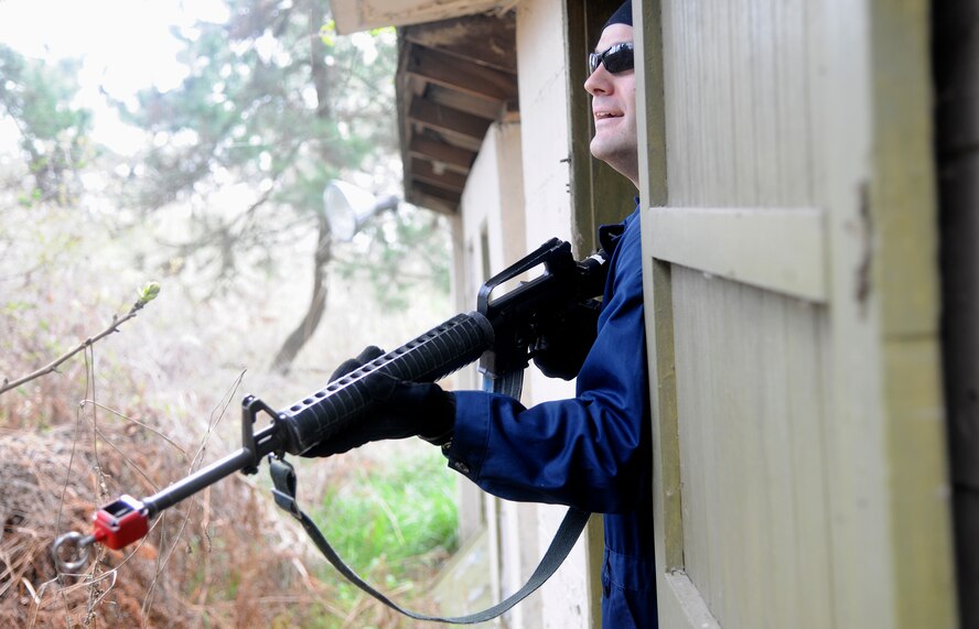 Master Sgt. Jeremy Lindner, 8th Maintenance Operations Squadron first sergeant, looks outside while acting as an opposing force member during a scenario for 8th Security Forces Squadron members to defend the base during an operational readiness exercise at Kunsan Air Base, Republic of Korea, April 24, 2012. BEVERLY MIDNIGHT 12-02 is the last phase of inspections by the Pacific Air Forces Inspector General Team.  The Wolf Pack will find out the inspection results on May 2 after the IG Team has finalized their report. (U.S. Air Force photo/Staff Sgt. Rasheen A. Douglas)
