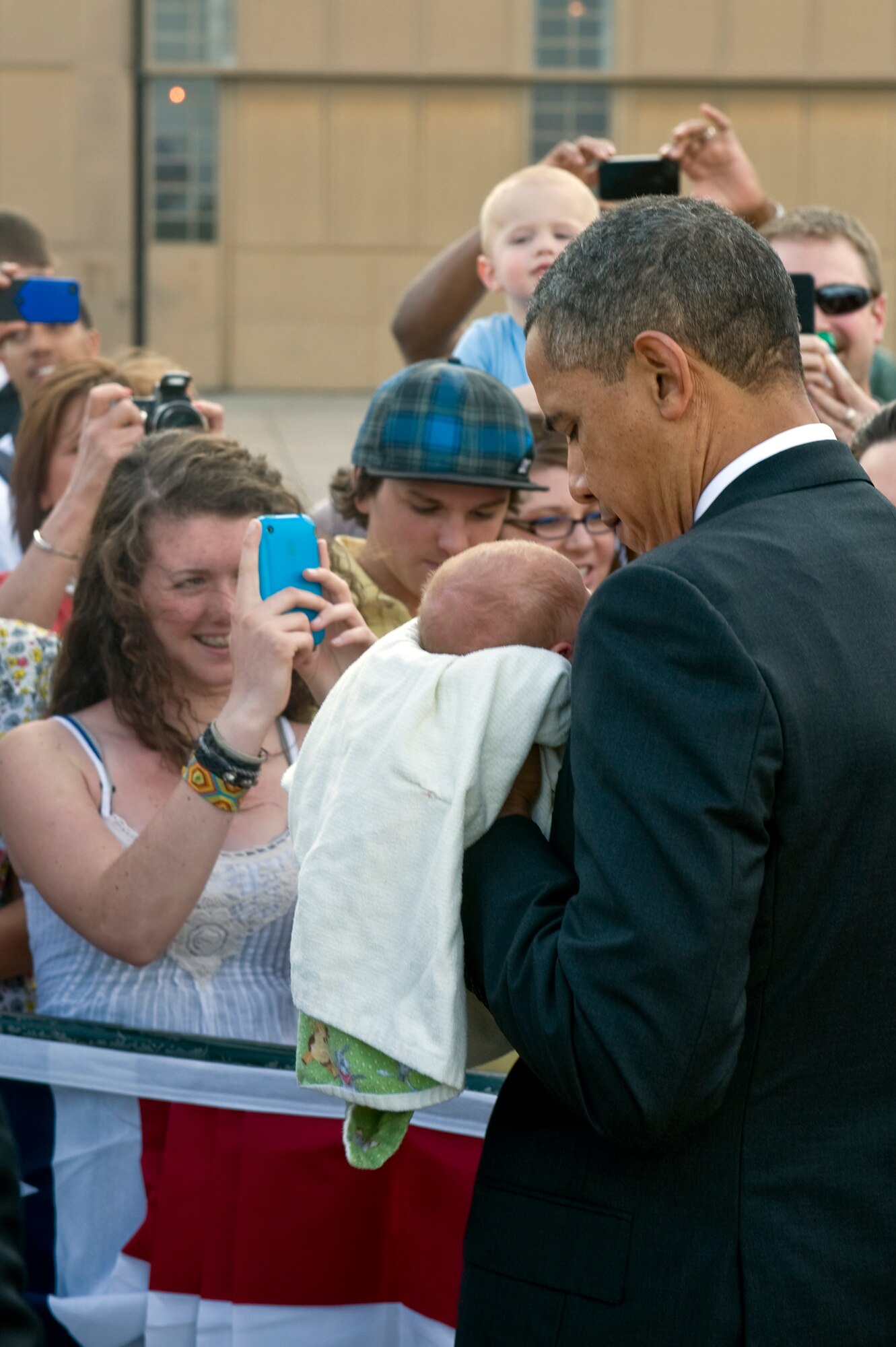 BUCKLEY AIR FORCE BASE, Colo. – President Barack Obama holds a baby from the crowd, here, April 24, 2012. (U.S. Air Force photo by Airman 1st Class Riley Johnson)