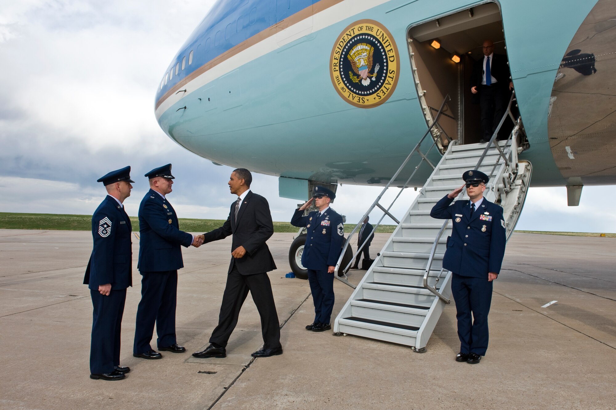 BUCKLEY AIR FORCE BASE, Colo. -- President Barack Obama is greeted by Col. Daniel Dant, 460th Space Wing commander, middle, and Chief Master Sgt. William Ward, 460th Space Wing command chief, left, April 24, 2012. Obama arrived at Buckley AFB on his way to speak at the University of Colorado Boulder. (U.S. Air Force photo by Airman 1st Class Riley Johnson)