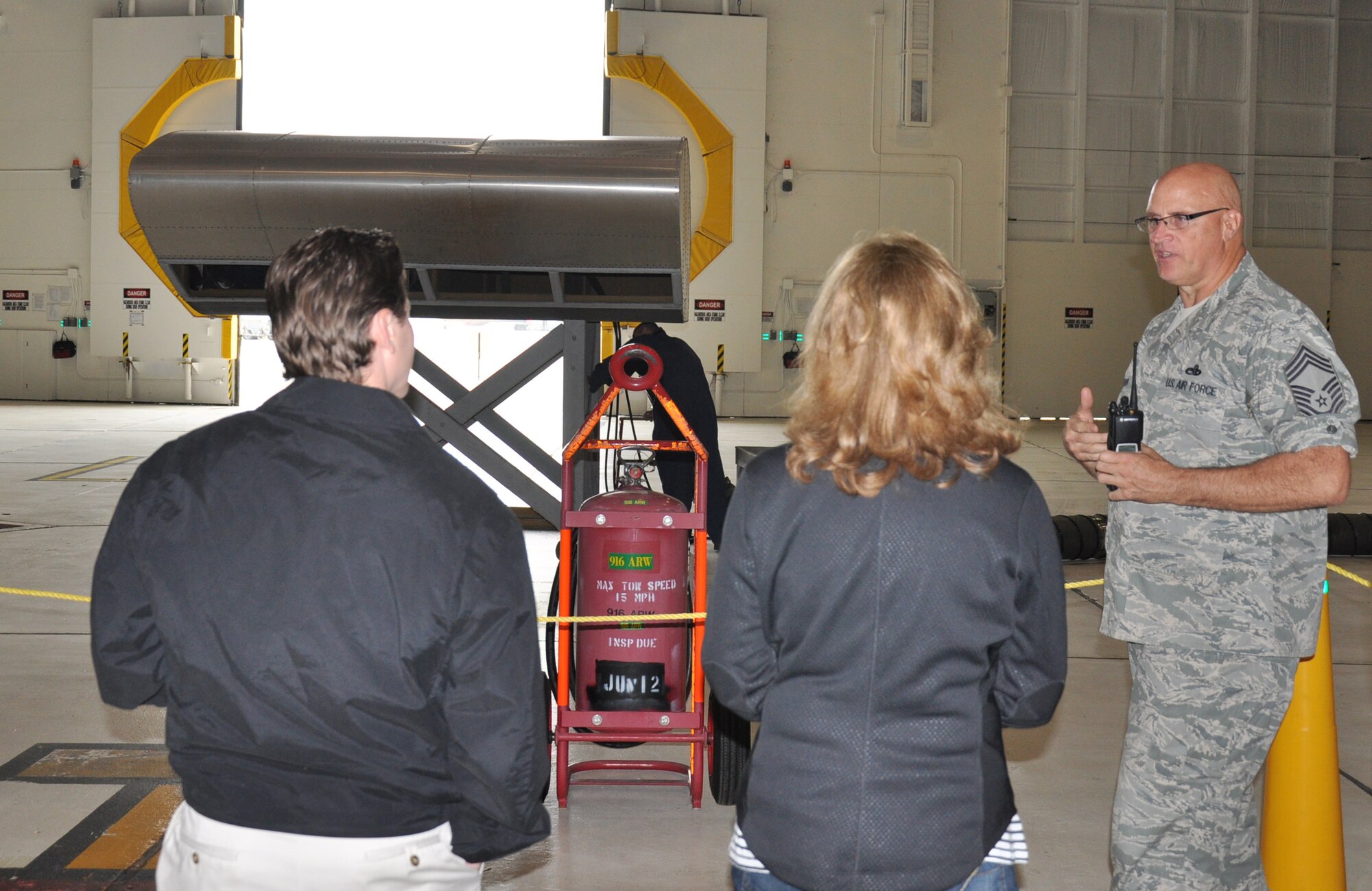 Chief Master Sgt. Tim Erdmann (right), 916th Maintenance Group, talks employers through a confined space exercise on April 21, 2012 during the wing's Employer Day event.( U.S. Air Force photo/Maj. Shannon Mann/Released) 
