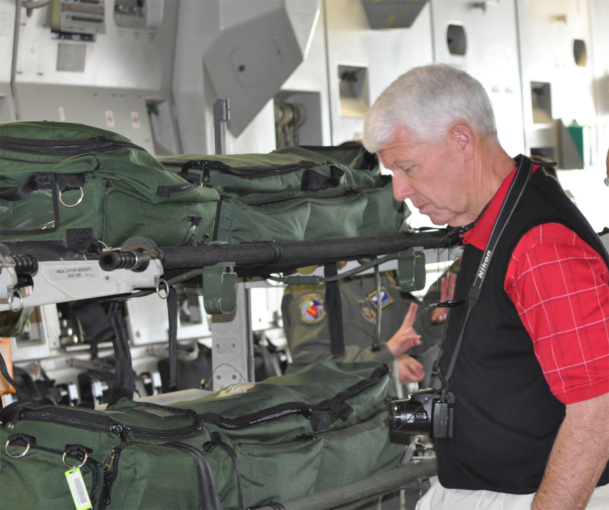 Ben Bradsher, vice president for Gregory Poole Equipment, looks at an aeromedical evacuation setup on a C-17 Galaxy at the 445th Airlift Wing. Bradsher is a North Carolina employer who was part of a civic leader tour to Wright Patterson AFB, Ohio sponsored by the 916th Air Refueling Wing and the NC Employer Support of the Guard and Reserve (U.S. Air Force photo/Maj. Shannon Mann/Released)