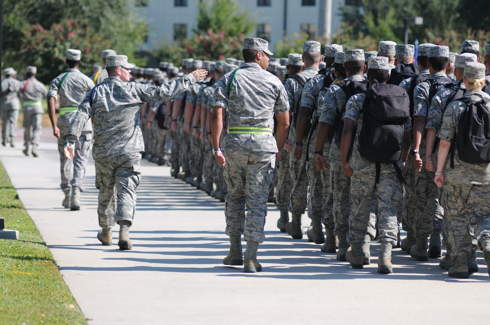 Tech. Sgt. Willard Mitchell, 338th Training Squadron military training leader, marches a flight of students toward the Triangle at Keesler Air Force Base, Miss, 2011. While the duties of an individual MTL vary greatly depending on the needs of their squadron, their essential mission is to mentor and care for Airmen. (U.S. Air Force photo by Kemberly Groue)