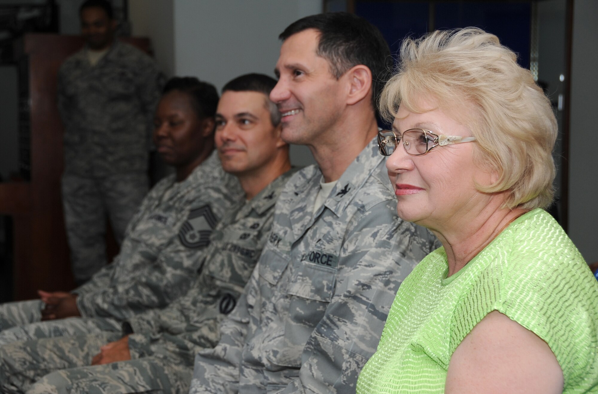 Ruthie Atchley, 81st Communications Squadron chief of base records management, listens to remarks made by Brig. Gen. Andrew Mueller, 81st Training Wing commander, at the 81st CS building at Keesler Air Force Base, Miss, April 17, 2012, on the dedication and commitment Atchley provided to the Air Force during her 40 years of service as a Department of Defense civil service member.  (U.S. Air Force photo by Kemberly Groue)